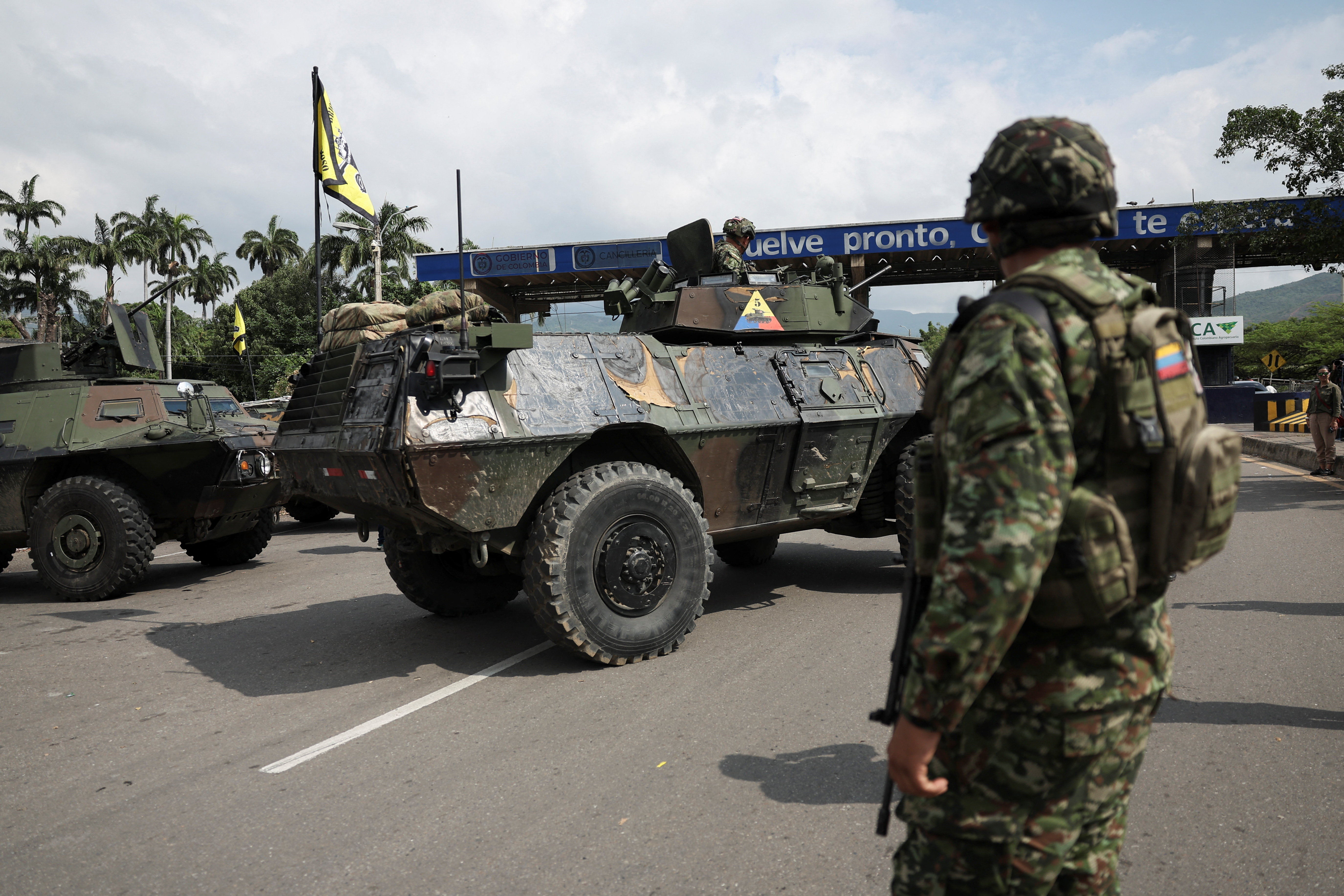 A Colombian soldier stands at the border between Venezuela and Colombia [Luisa Gonzalez/Reuters]