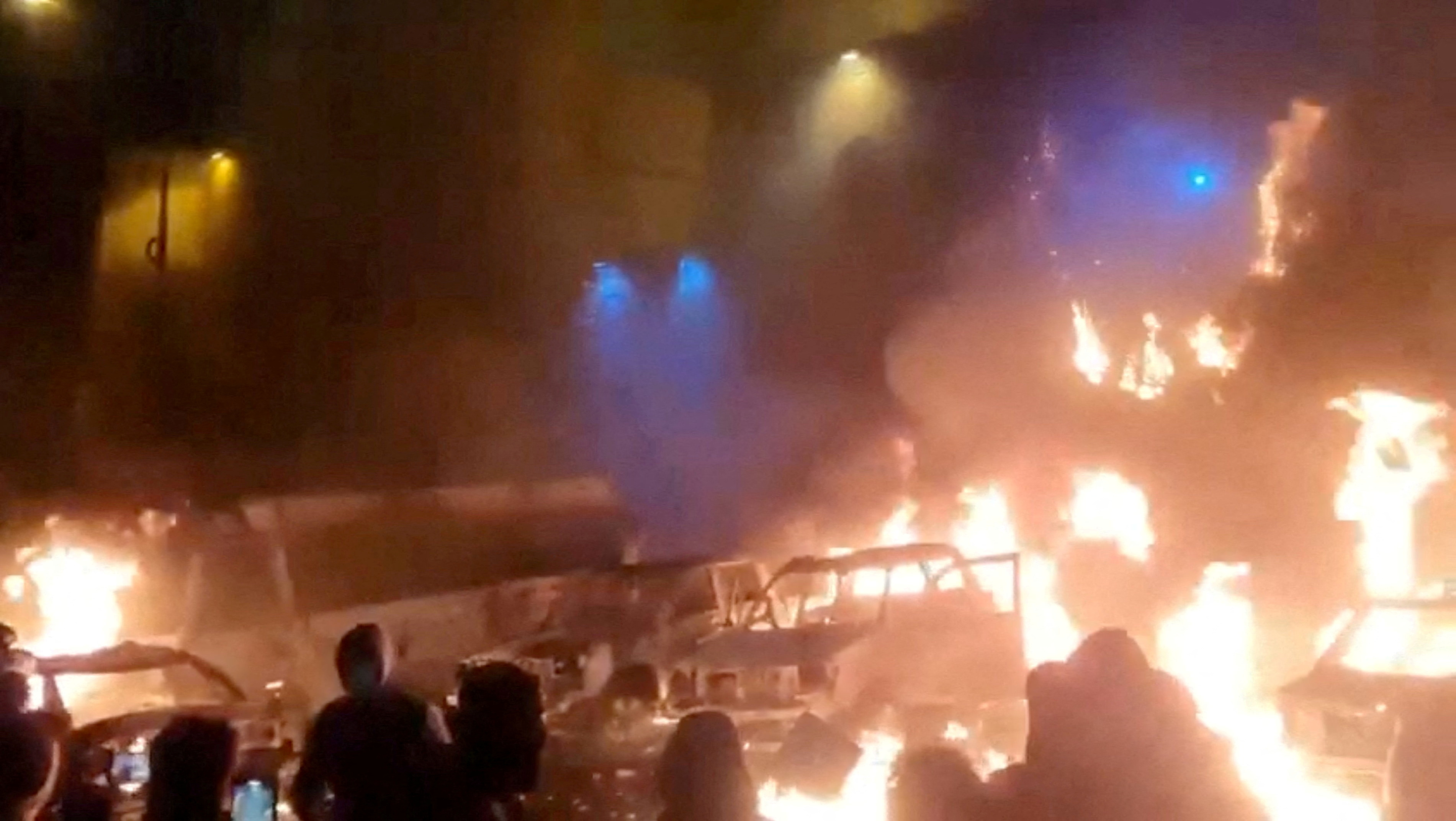 Protesters gather as vehicles burn, amid evolving anti-government unrest, in Tehran, Iran, in this screen grab obtained from a social media video released on January 9, 2026. [File: Social Media/via Reuters]