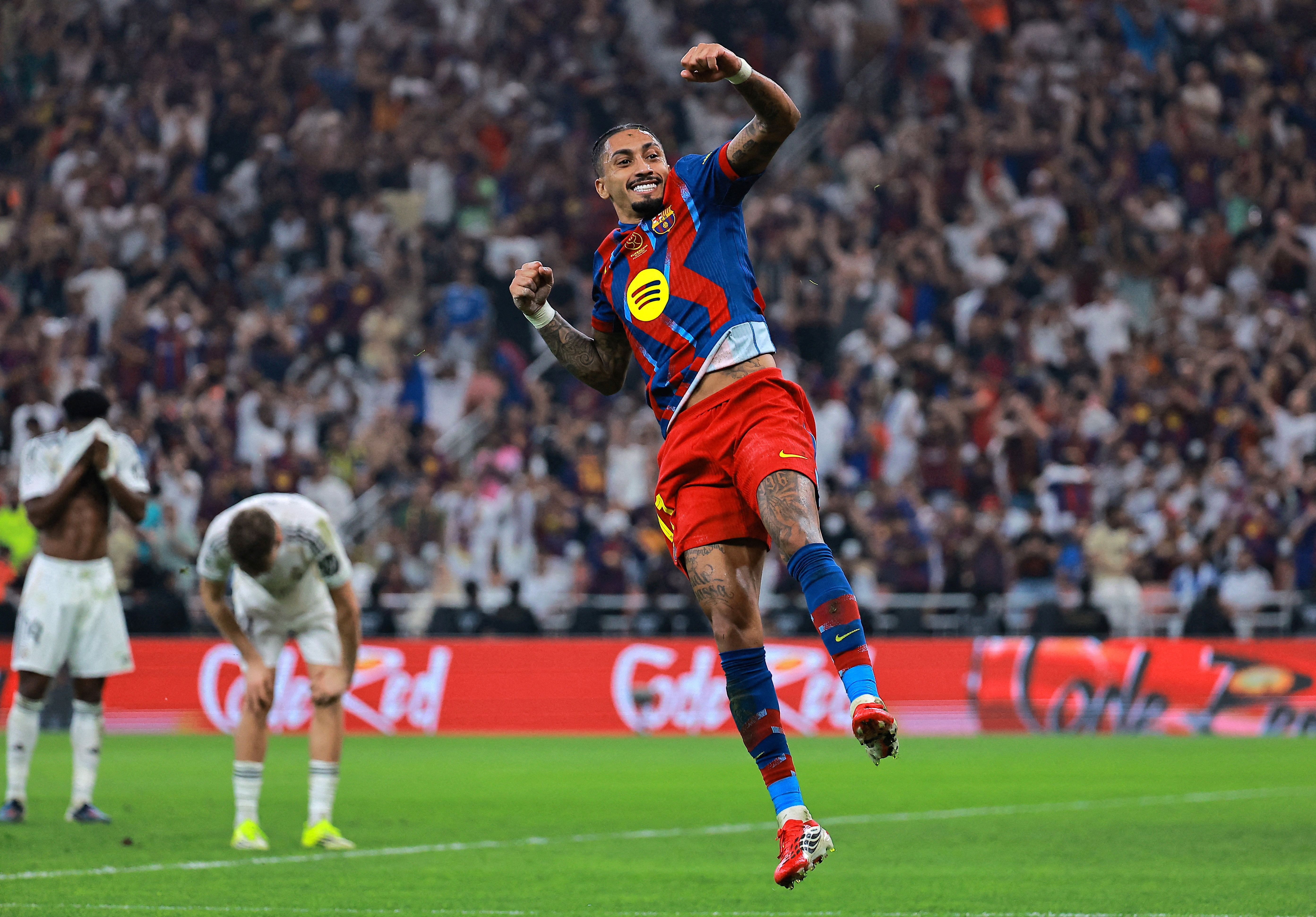 Barcelona's Raphinha celebrates scoring their third goal