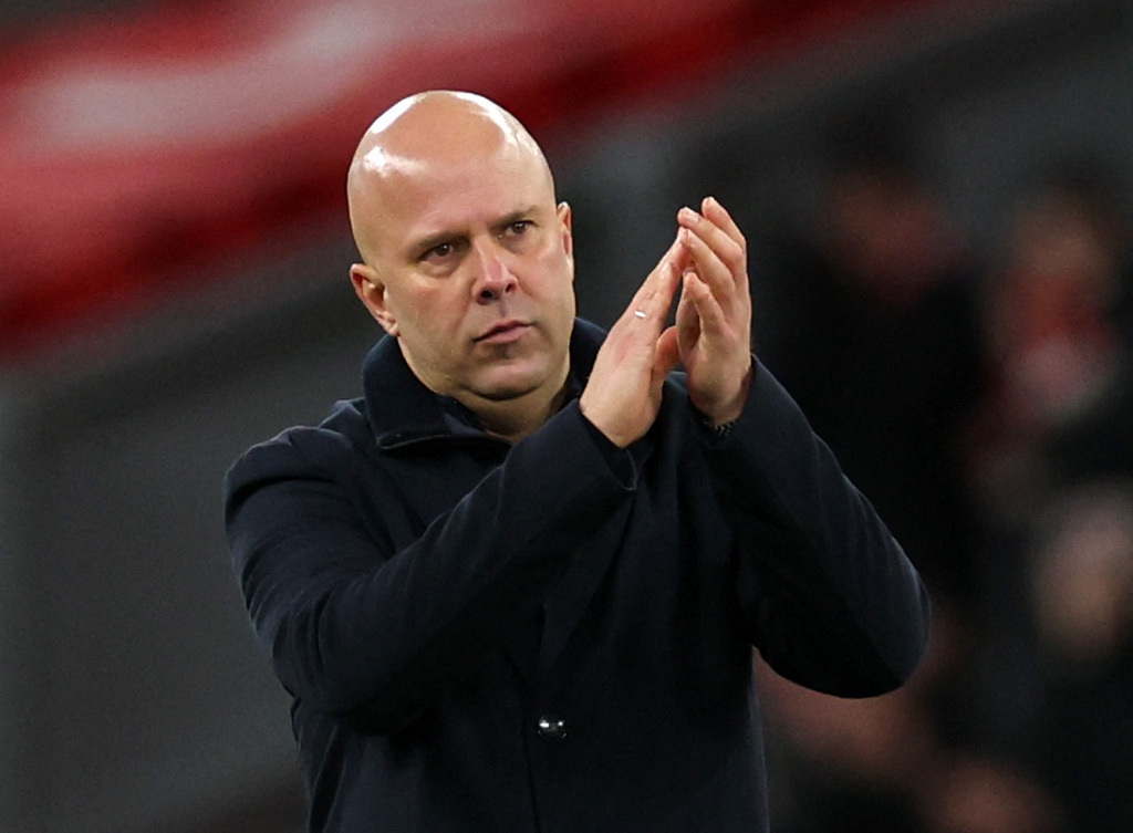 Liverpool manager Arne Slot celebrates after the match