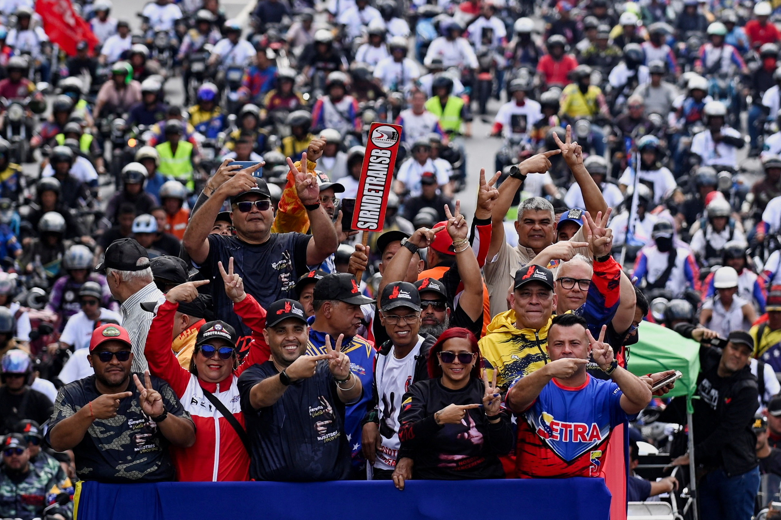 Venezuelan transport workers travel in a caravan in support of captured President Nicolas Maduro and his wife Cilia Flores, over a week after the U.S. launched a strike on the country, in Caracas