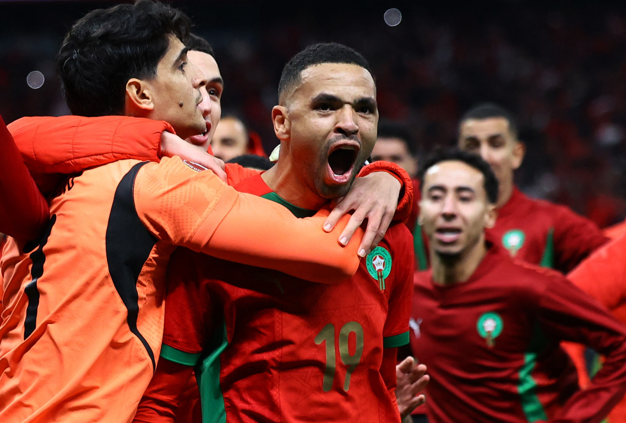 Morocco's Youssef En-Nesyri and teammates celebrate after winning the match in the penalty shootout