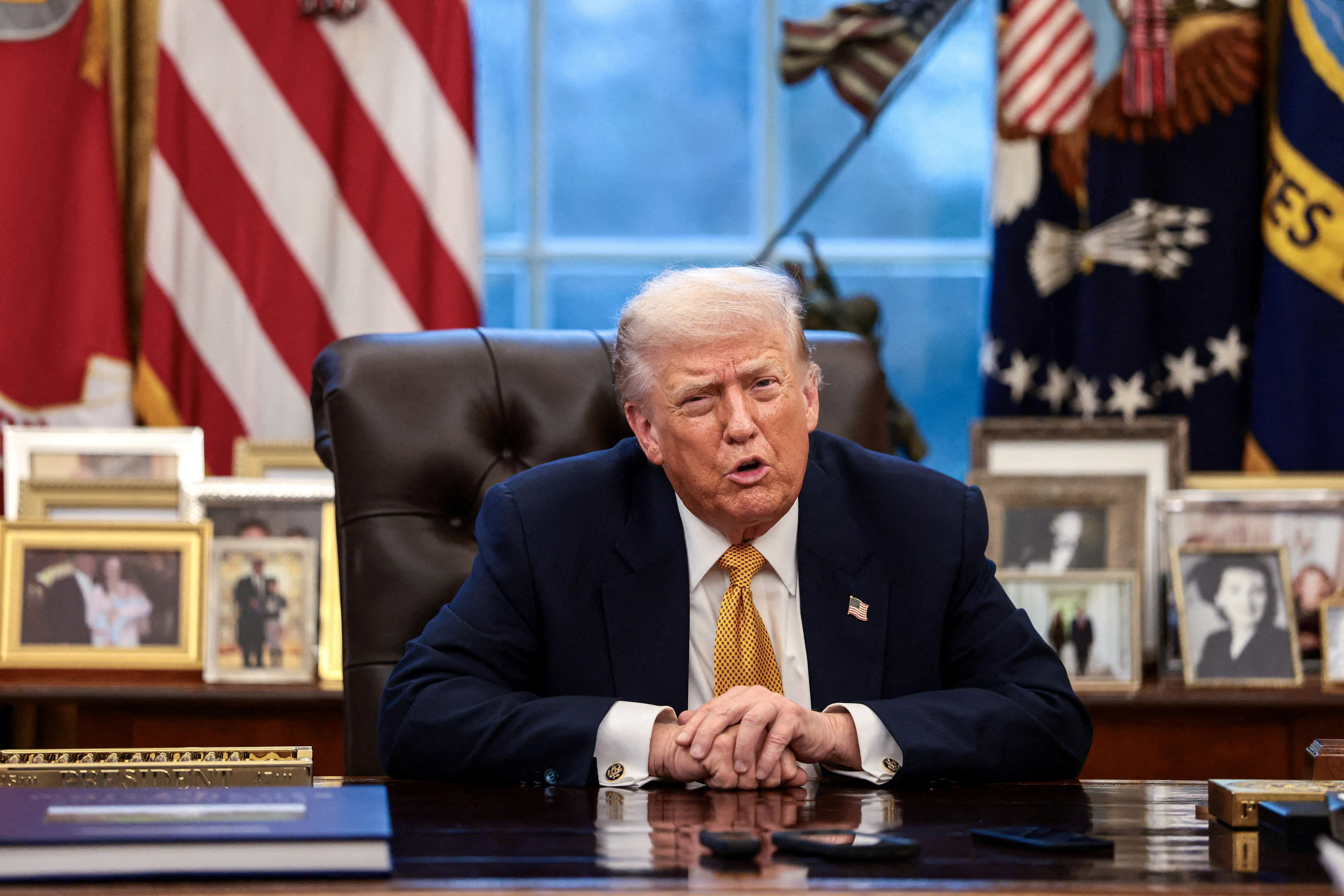 US President Donald Trump is interviewed at his desk.
