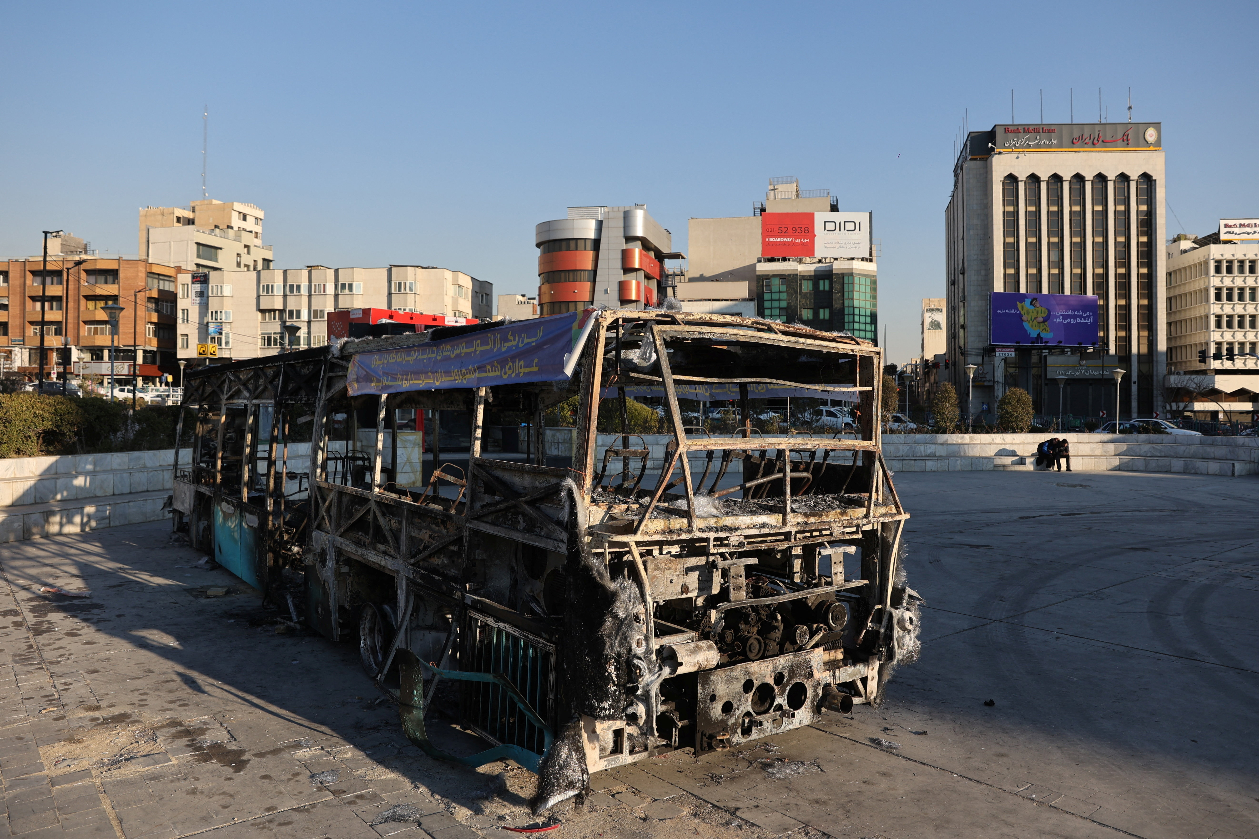 A burned bus in Tehran, Iran