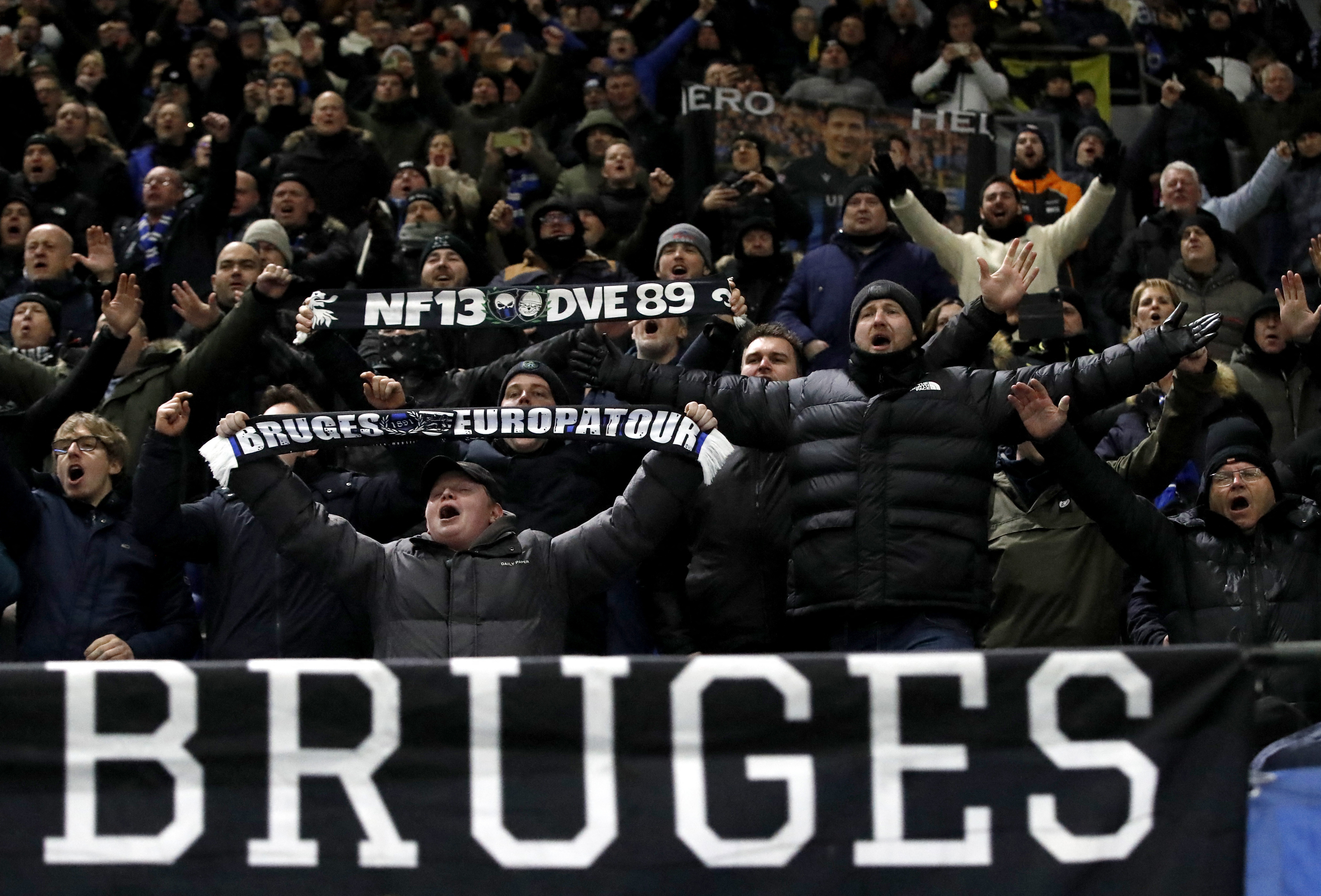 Club Brugge fans celebrate in the stands after the match