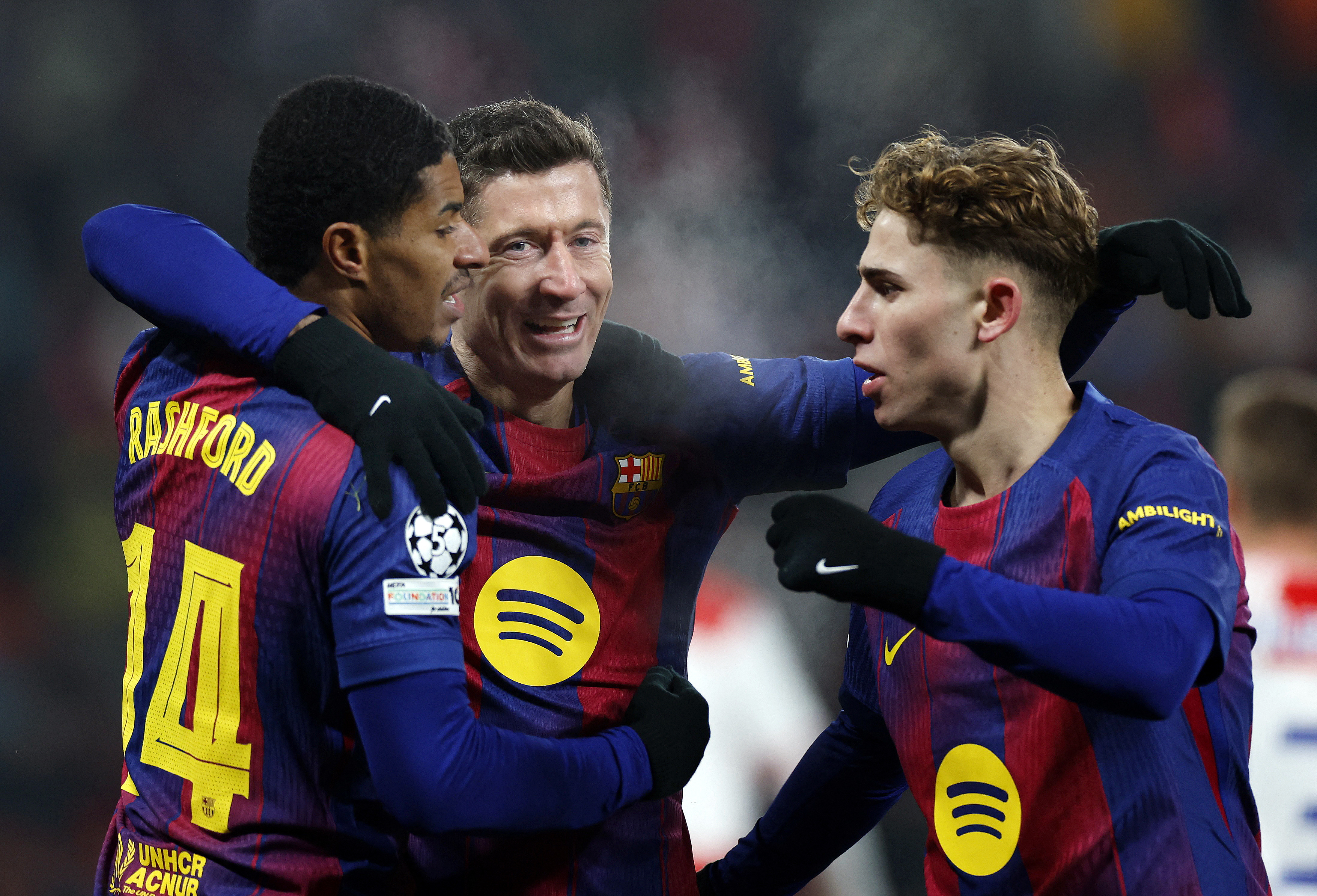 Barcelona's Robert Lewandowski celebrates scoring their fourth goal with FC Barcelona's Marcus Rashford and FC Barcelona's Fermin Lopez