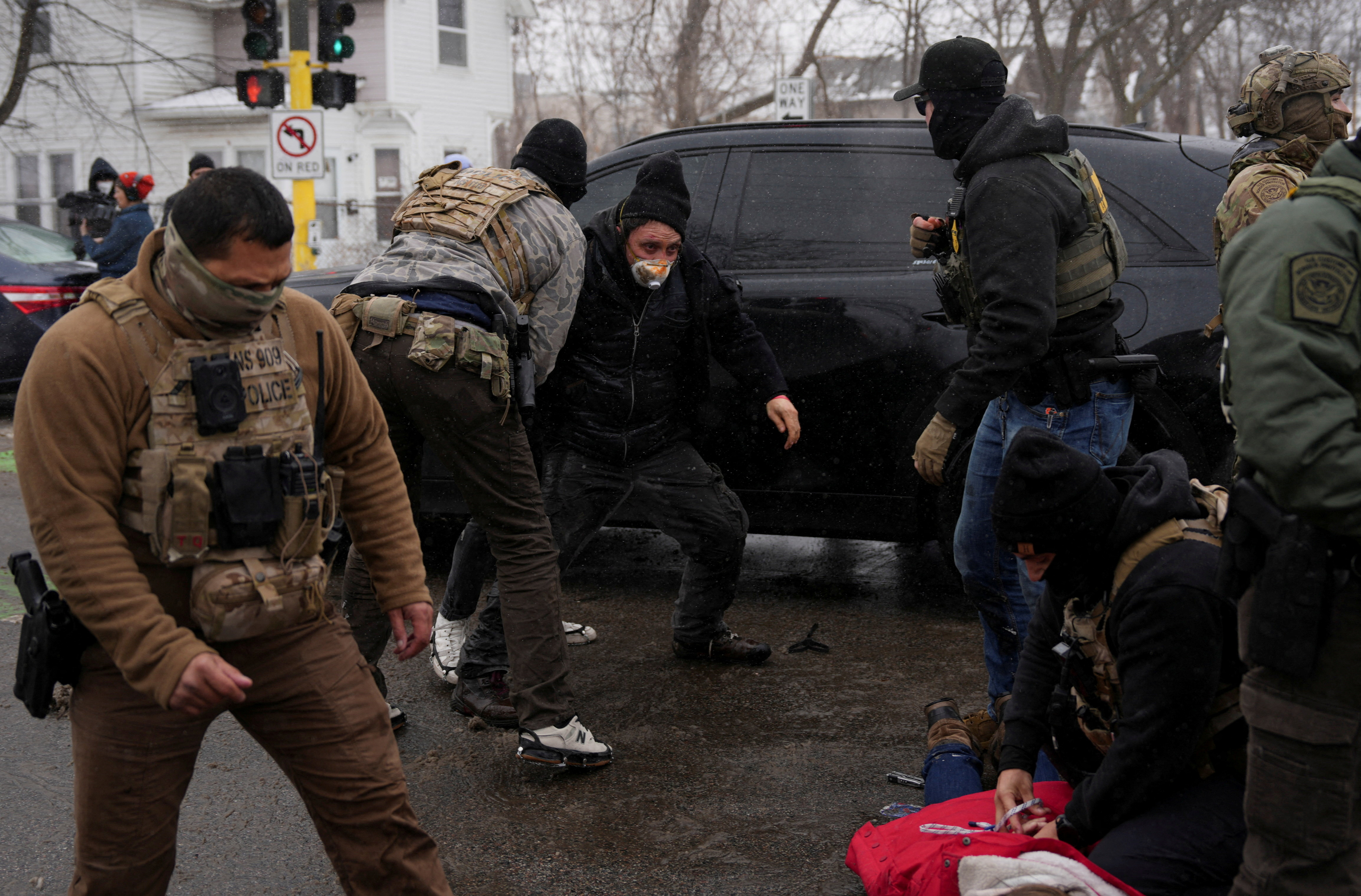 FILE PHOTO: Federal agents detain locals as immigration enforcement continues after a U.S. Immigration and Customs Enforcement (ICE) agent fatally shot Renee Nicole Good on January 7 during an immigration raid, in Minneapolis, Minnesota, U.S., January 21, 2026. REUTERS/Leah Millis/File Photo