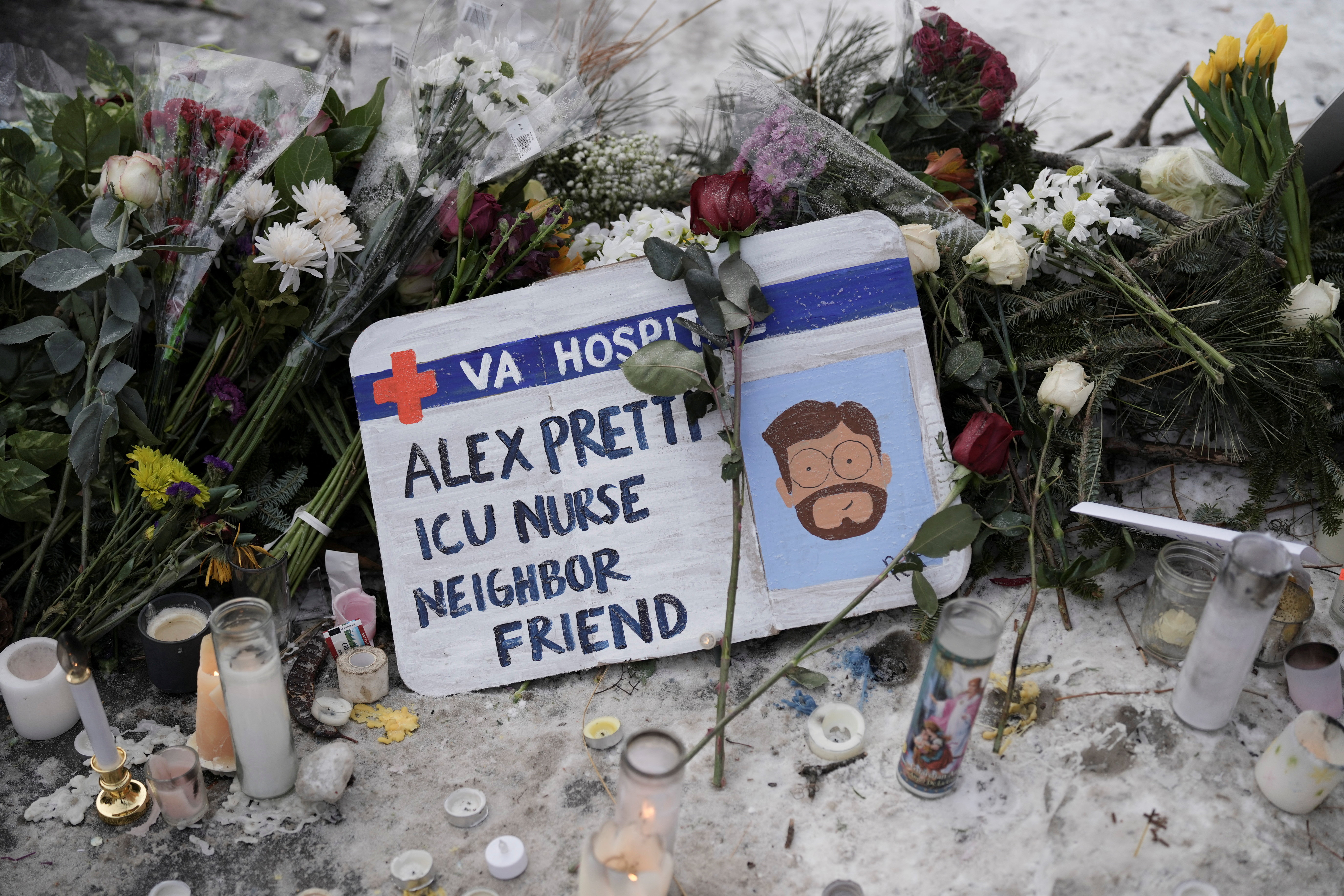 A sign at a makeshift memorial at the site where Alex Pretti was fatally shot by federal agents trying to detain him, in Minneapolis, Minnesota