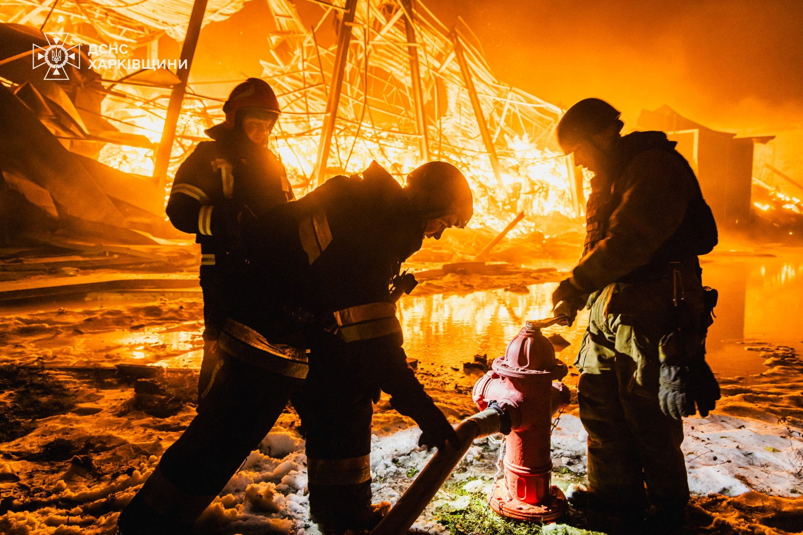 Firefighters work at the site of a private enterprise hit by an overnight Russian missile strike, amid Russia's attack on Ukraine, in Kharkiv, Ukraine, January 30, 2026. Press service of the State Emergency Service of Ukraine in Kharkiv region/Handout via REUTERS ATTENTION EDITORS - THIS IMAGE HAS BEEN SUPPLIED BY A THIRD PARTY. DO NOT OBSCURE LOGO