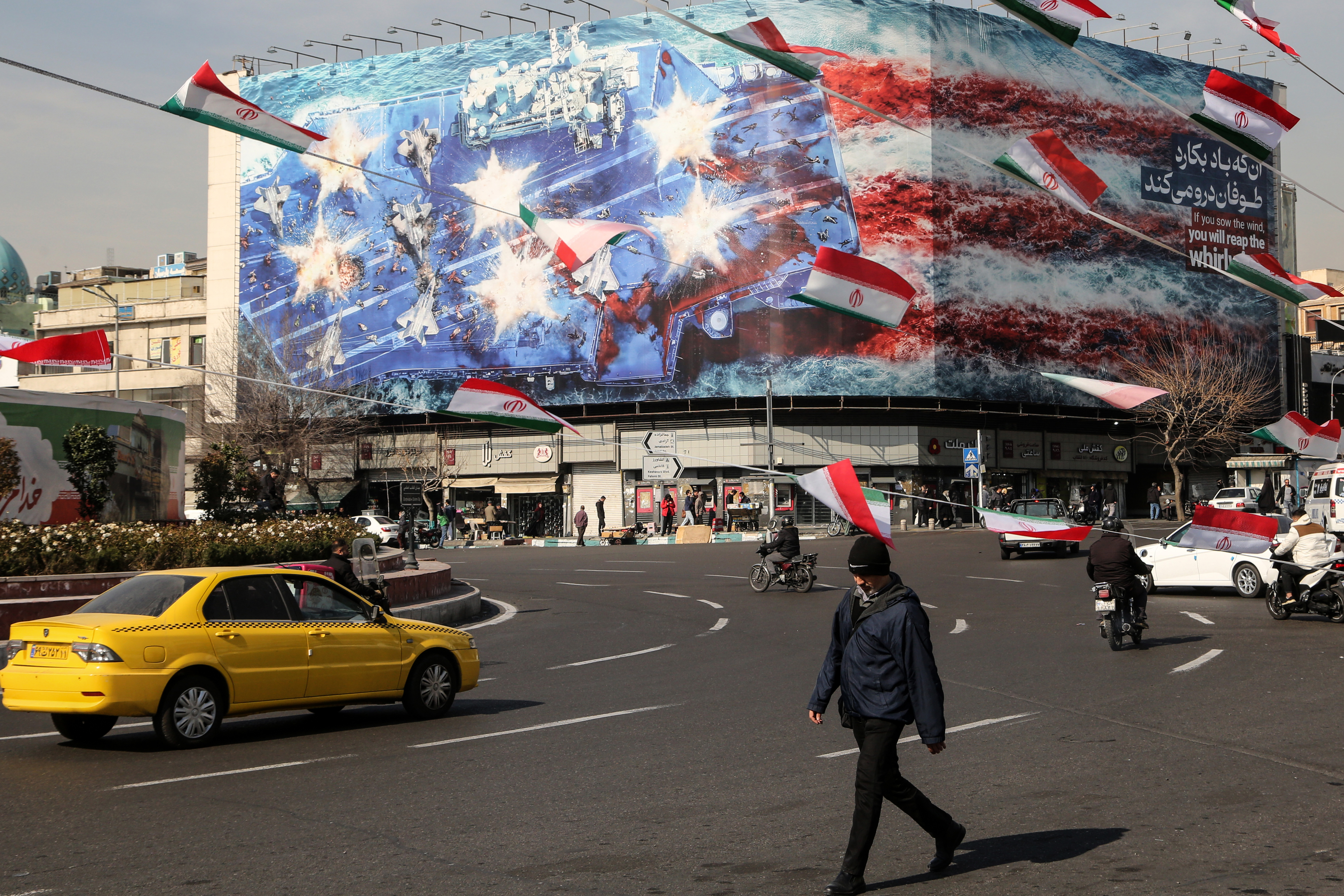 Anti-American posters and Iranian flags displayed in Tehran