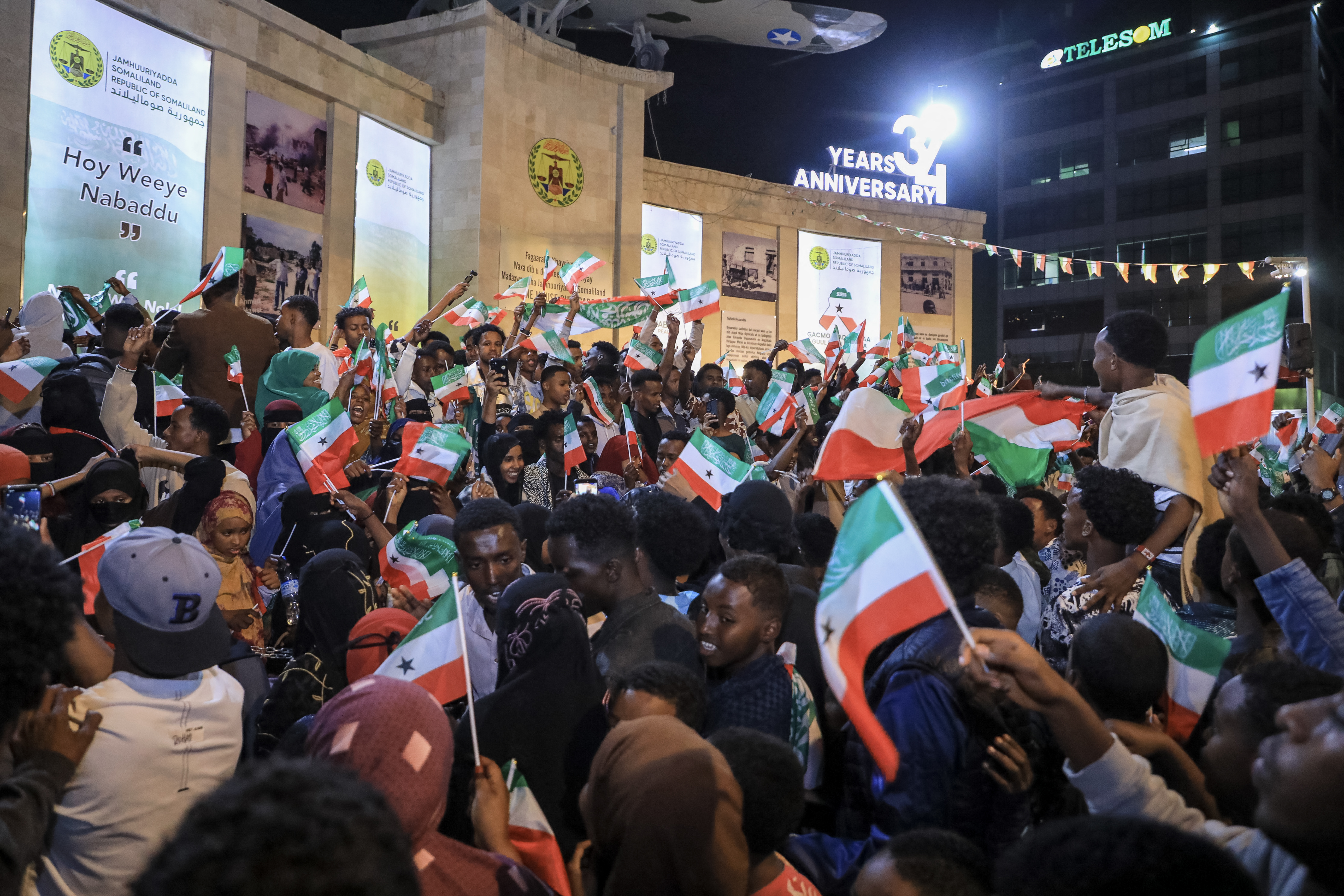 Residents wave Somaliland flags as they gather to celebrate Israel's announcement recognising Somaliland.