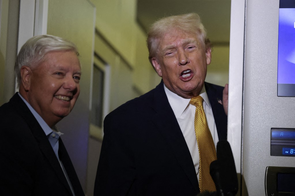 US President Donald Trump (R) and Senator Lindsey Graham (R-SC) speak to the media.