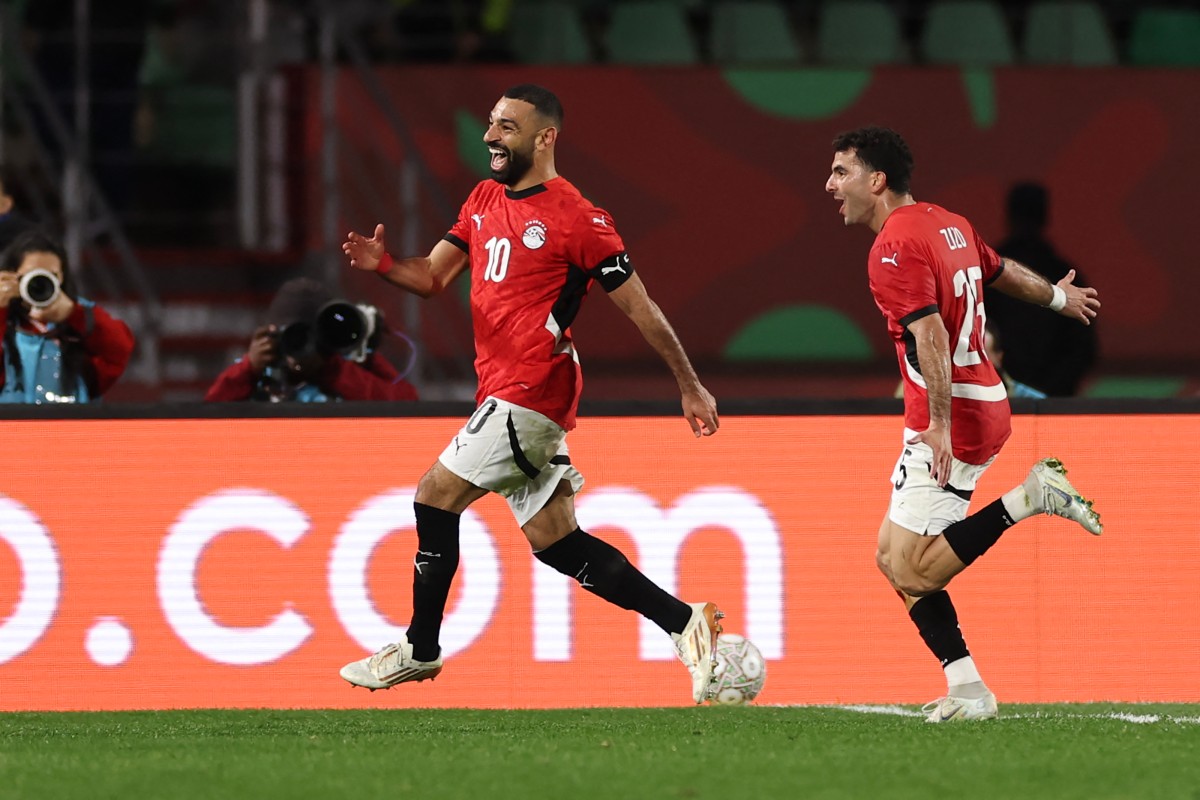 Egypt's forward Mohamed Salah celebrates scoring his team's third goal during the Africa Cup of Nations (AFCON) round of 16 football match against Benin