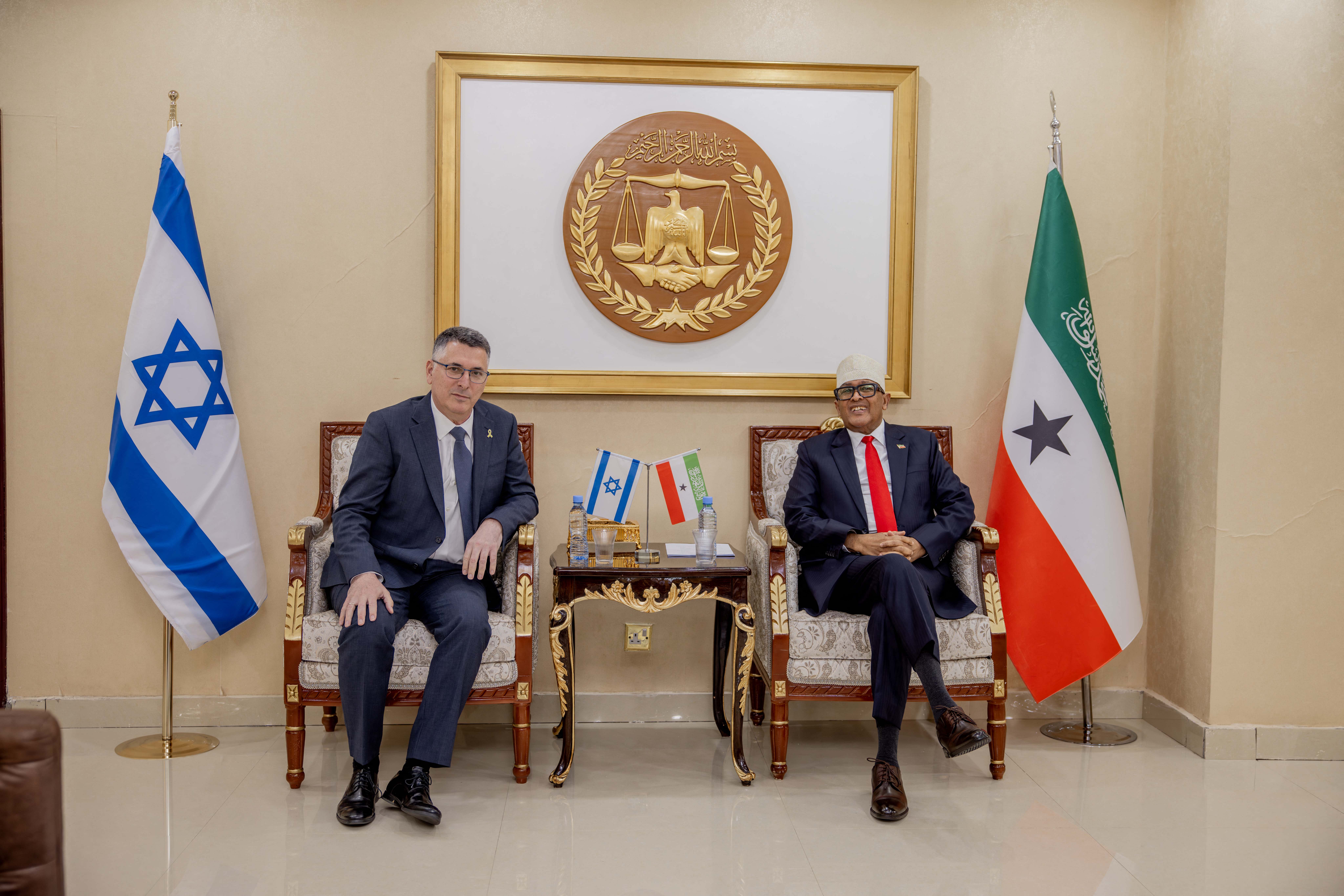 Somaliland's President Abdirahman Abdullahi Mohamed (R) posing for a photograph with Israel's Foreign Minister Gideon Saar.