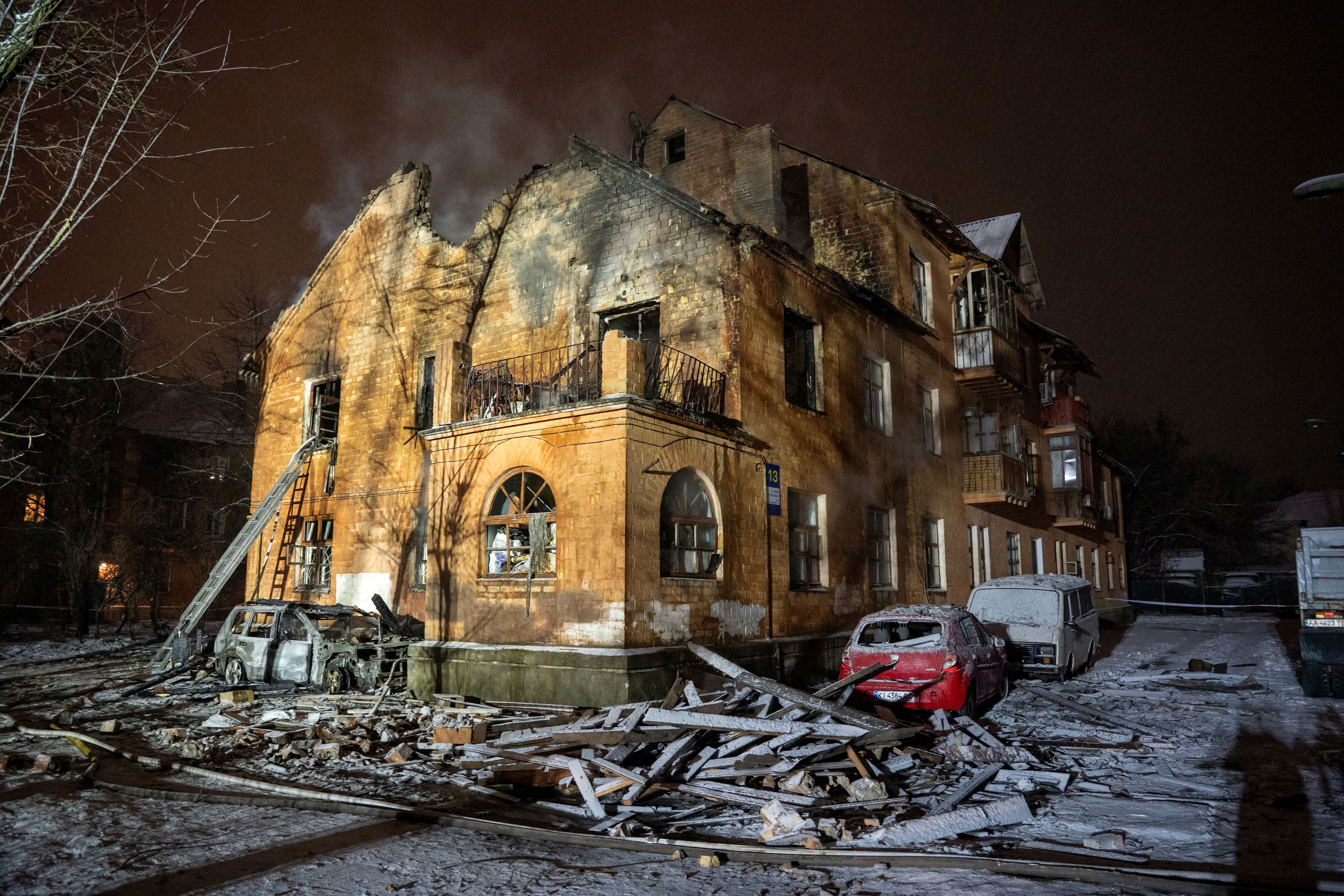 This photograph shows a heavily damaged residential building following a Russian drone and missile attacks in Kyiv