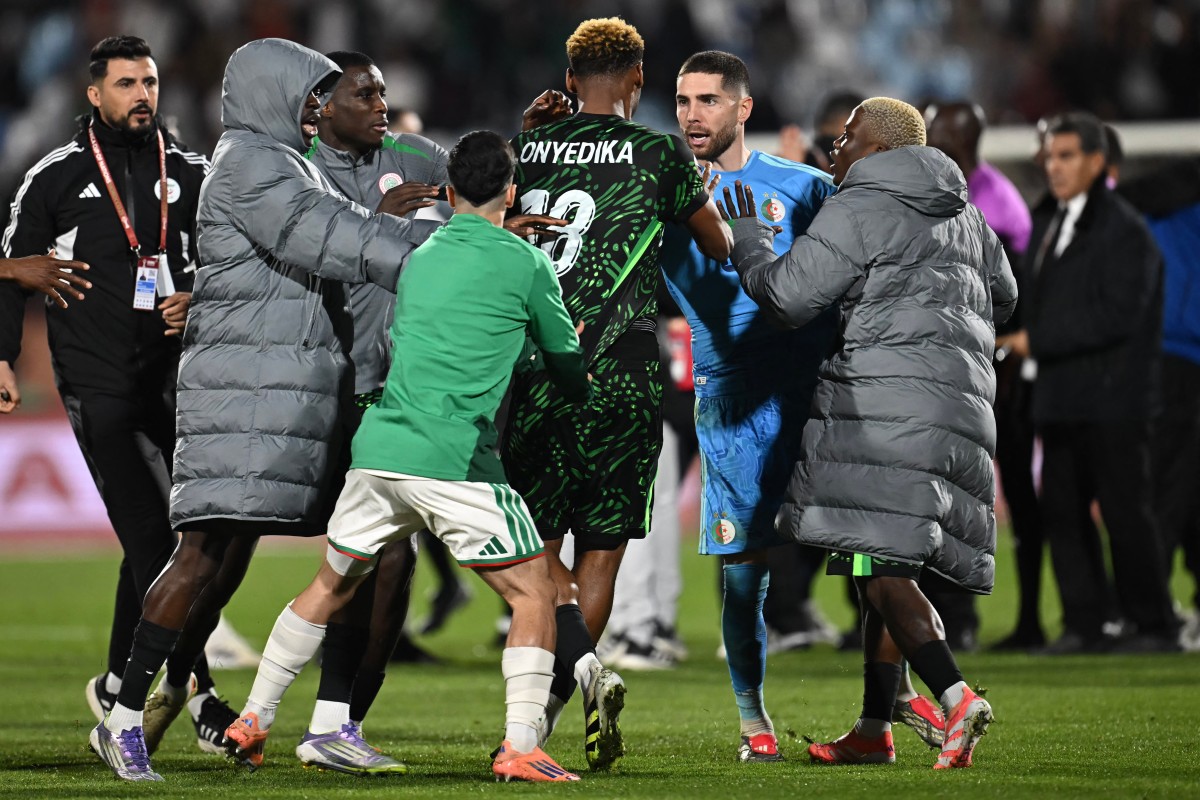 Nigeria's midfielder #18 Raphael Onyedika, Algeria's goalkeeper #23 Luca Zidane and players argue during the Africa Cup of Nations (CAN) quarter-final football match between Algeria and Nigeria at the Grand stadium in Marrakesh on January 10, 2026. (Photo by Paul ELLIS / AFP)