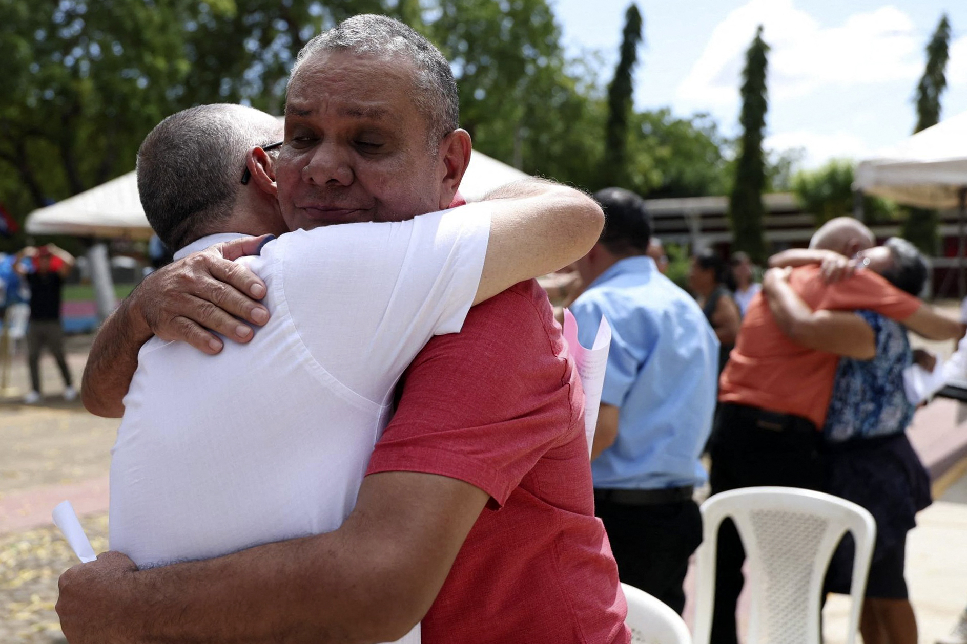 Political prisoners hugging relatives in Nicaragua