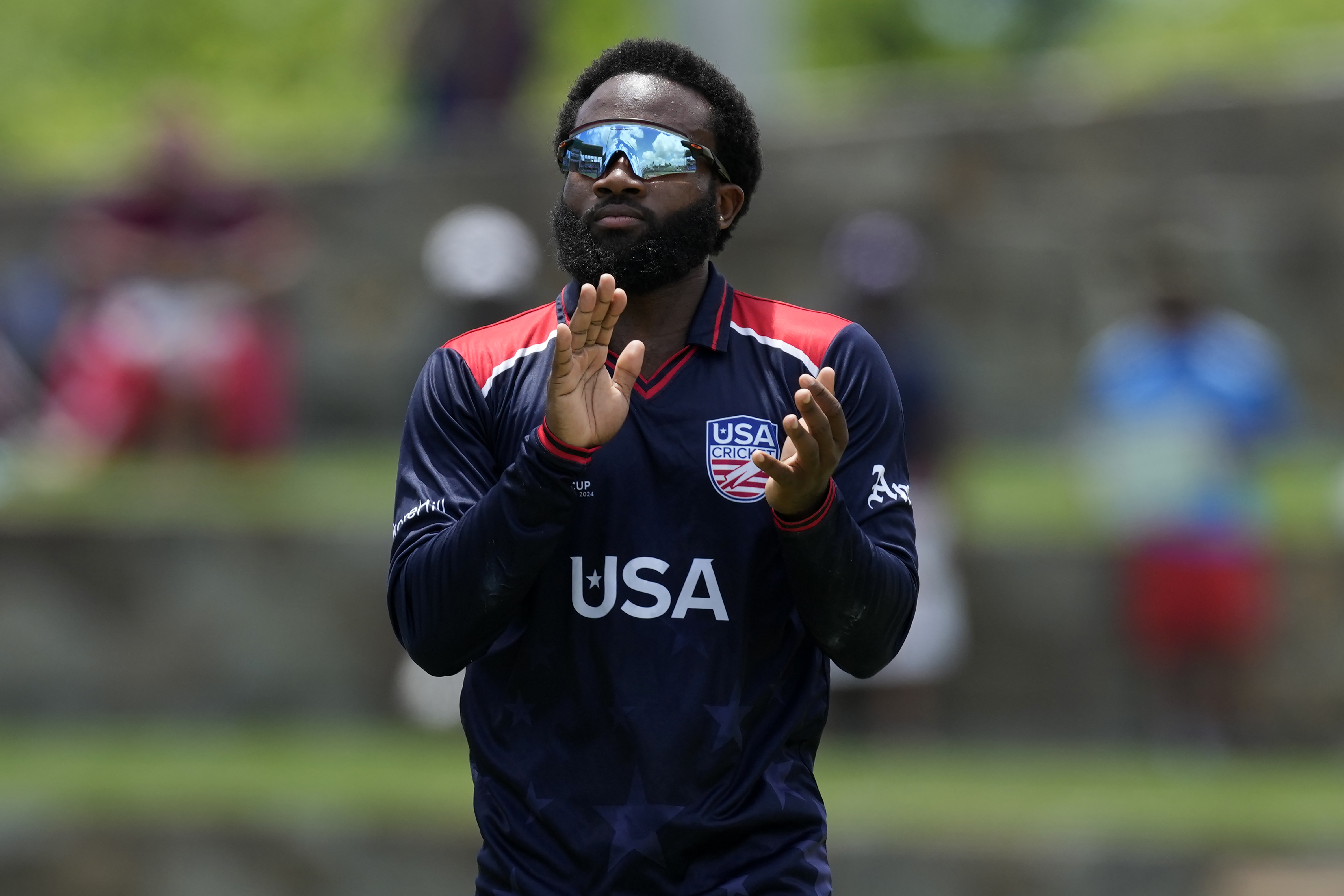 United States' stand-in captain Aaron Jones gestures towards his teammates during the ICC Men's T20 World Cup cricket match