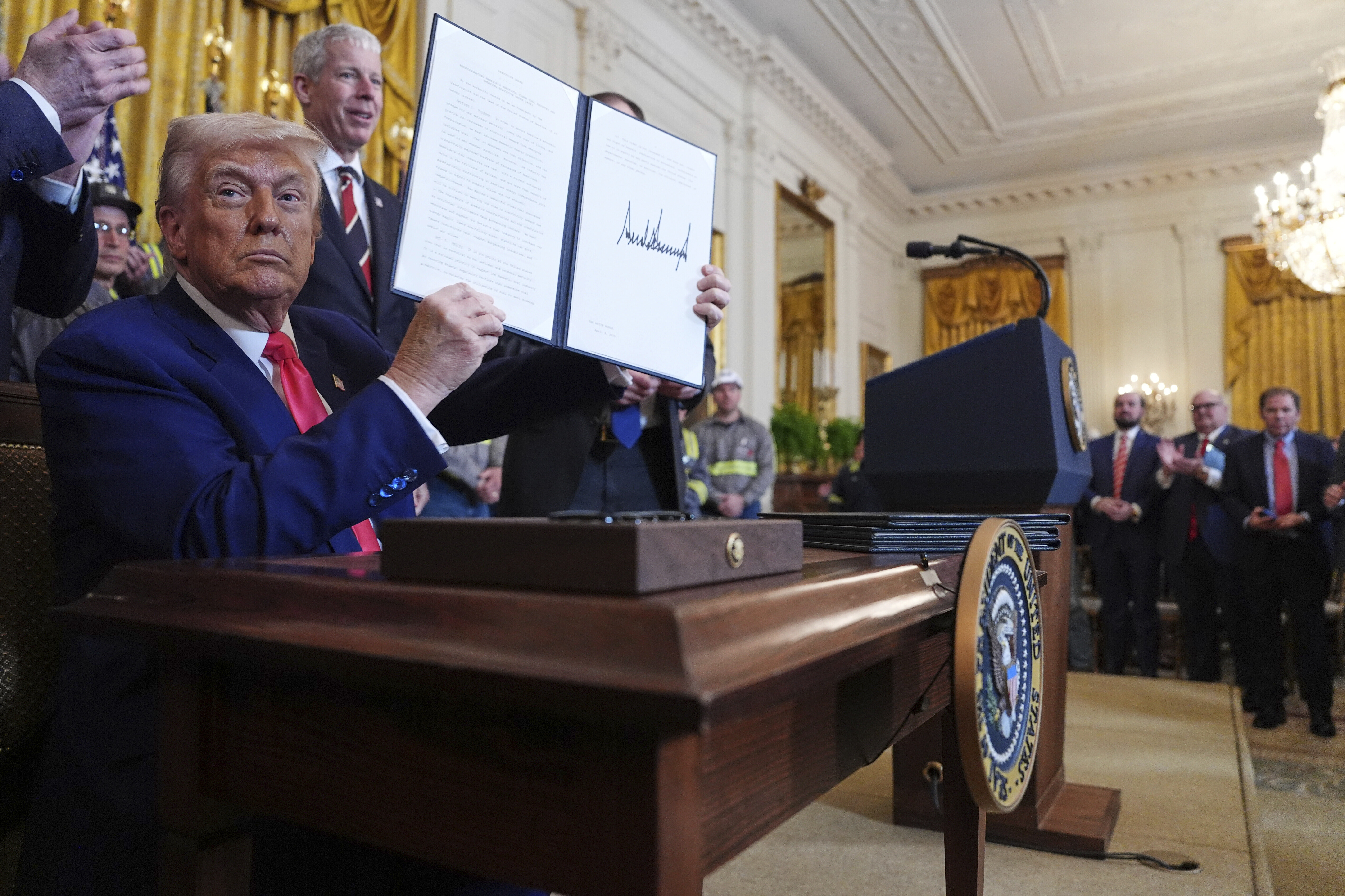 Trump holds up an executive order