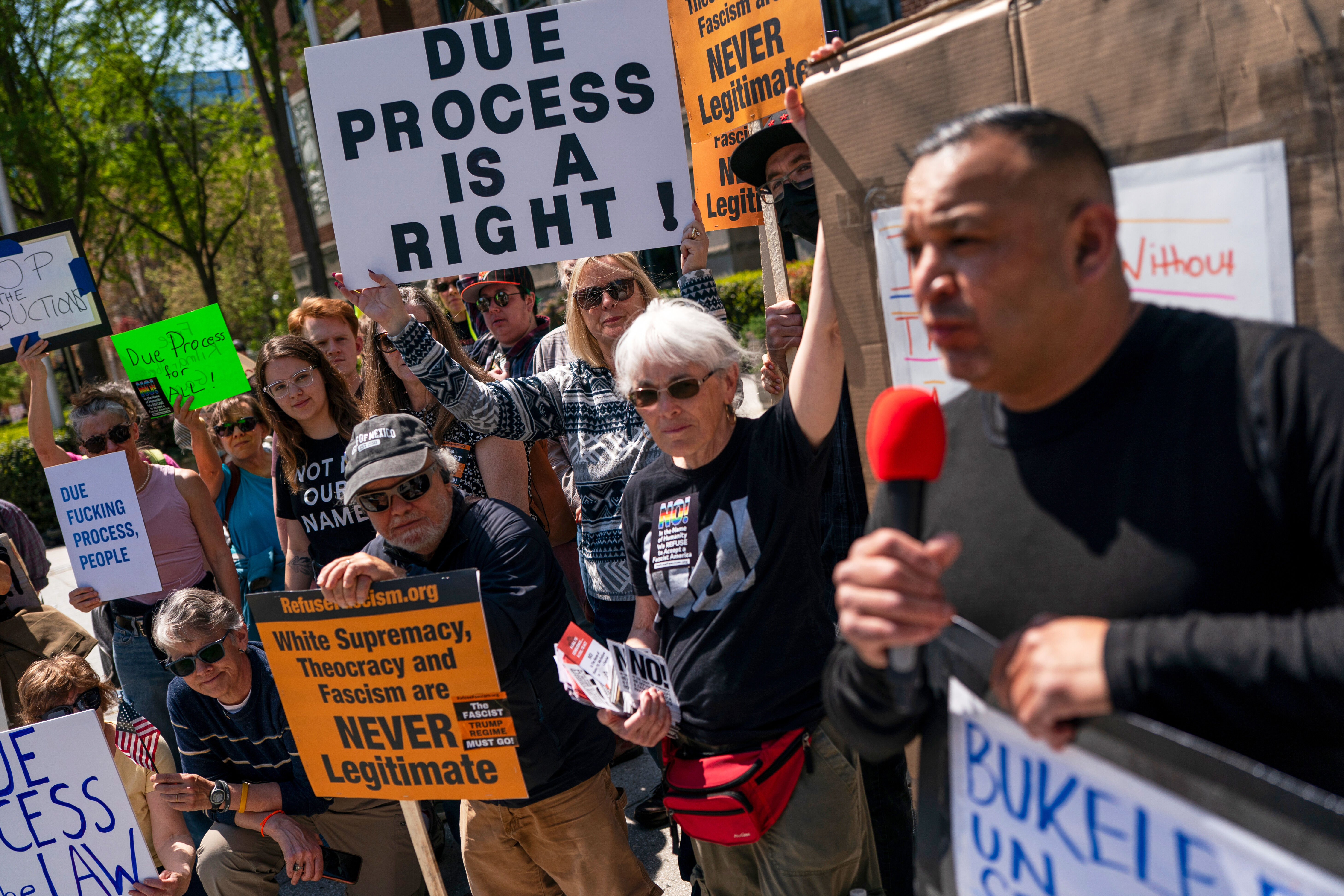 Protesters rally with signs like, "Due Process Is a Right"