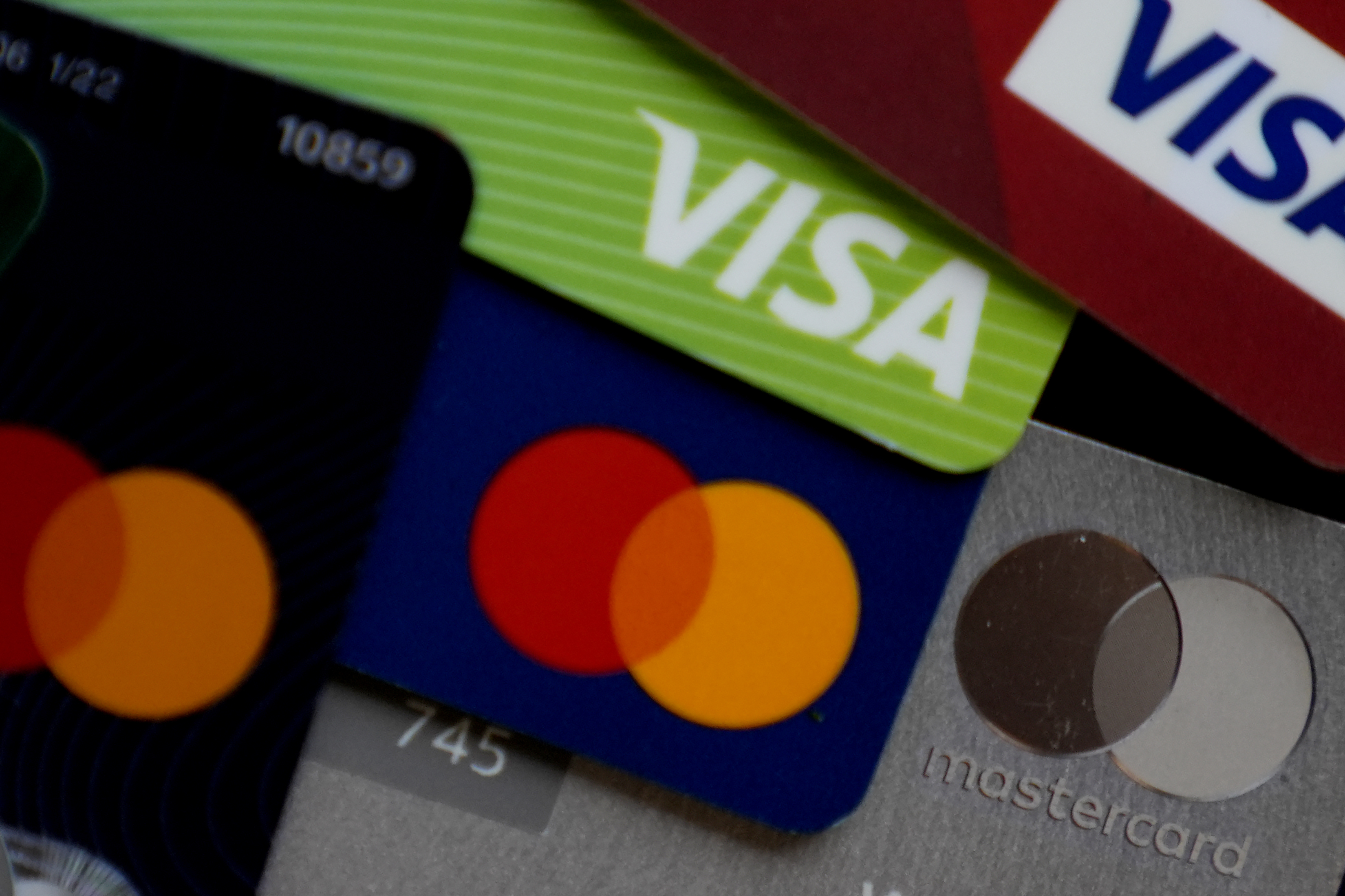 Several Visa and Mastercard credit cards are shown.