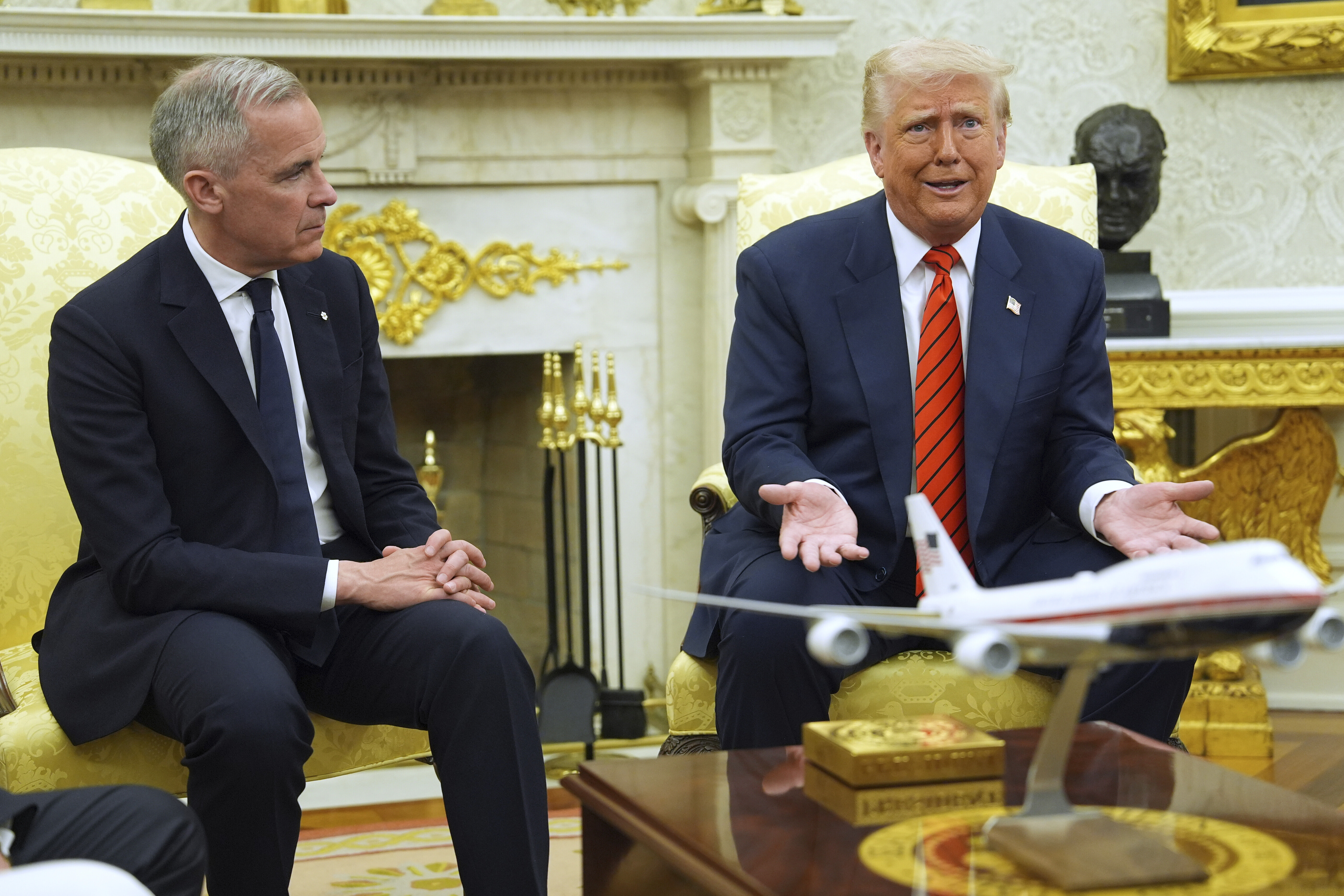 Mark Carney and Trump sit in the Oval Office
