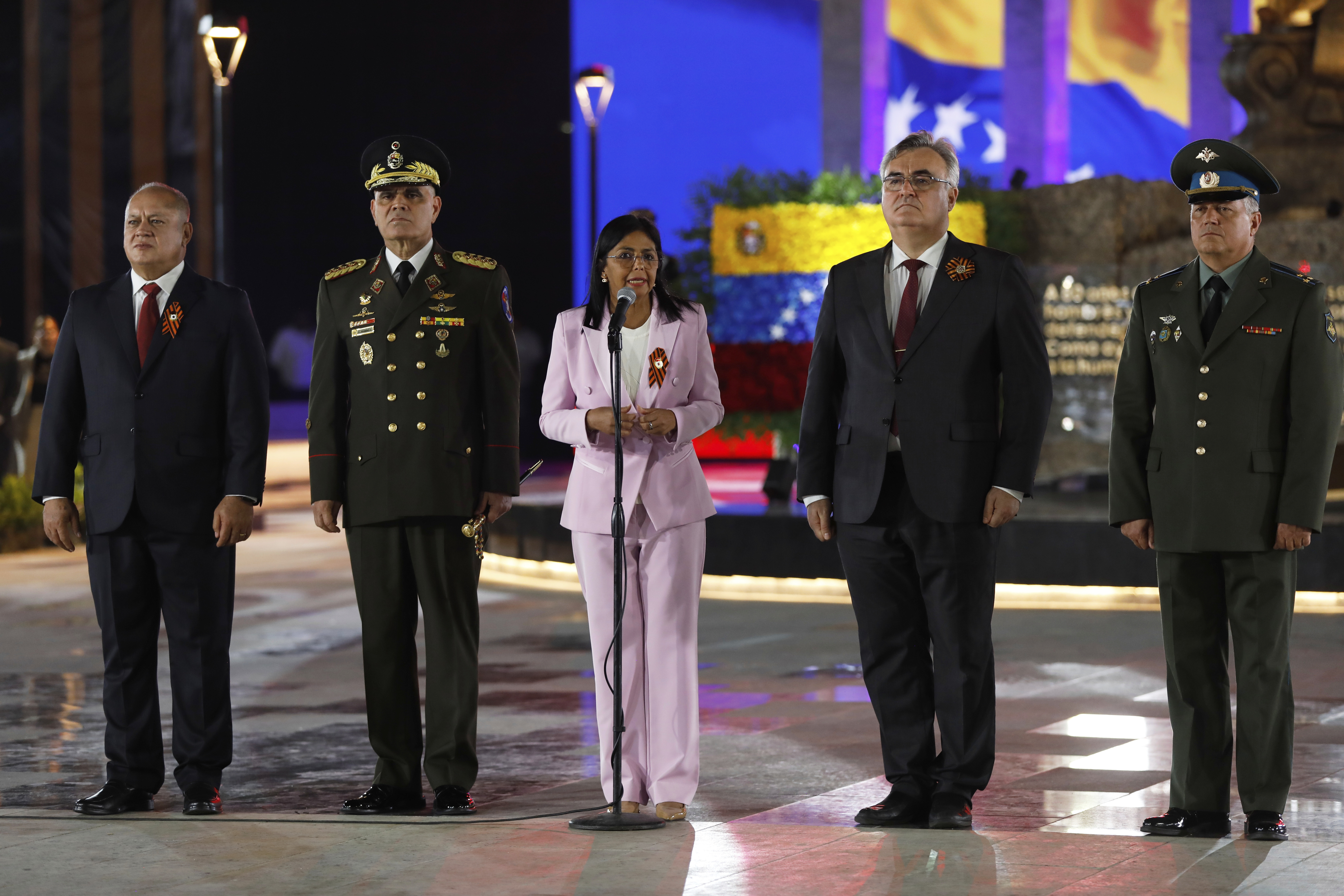 Venezuela's Interior Minister Diosdado Cabello, left, Defense Minister Vladimir Padrino Lopez, second from left, Vice President Delcy Rodriguez, center, and Russian Ambassador to Venezuela Sergey Melik-Bagdasarov, second from right, inaugurate a monument commemorating the 80th anniversary of the Soviet Union's victory over Nazi Germany in World War II in Caracas, Venezuela, Tuesday, May 13, 2025.(AP Photo/Cristian Hernandez)