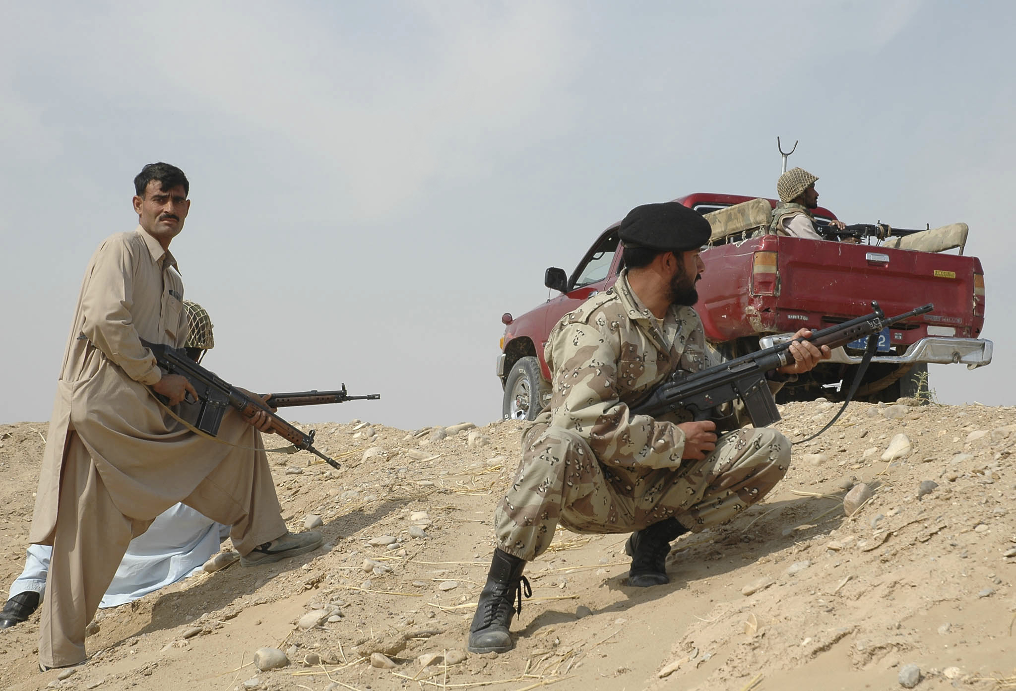 FILE -Troops of Pakistan para-military forces take position in the troubled area of Dera Bugti in Balochistan province of Pakistan, Jan 30, 2006. (AP Photo/Arshad Butt, File)