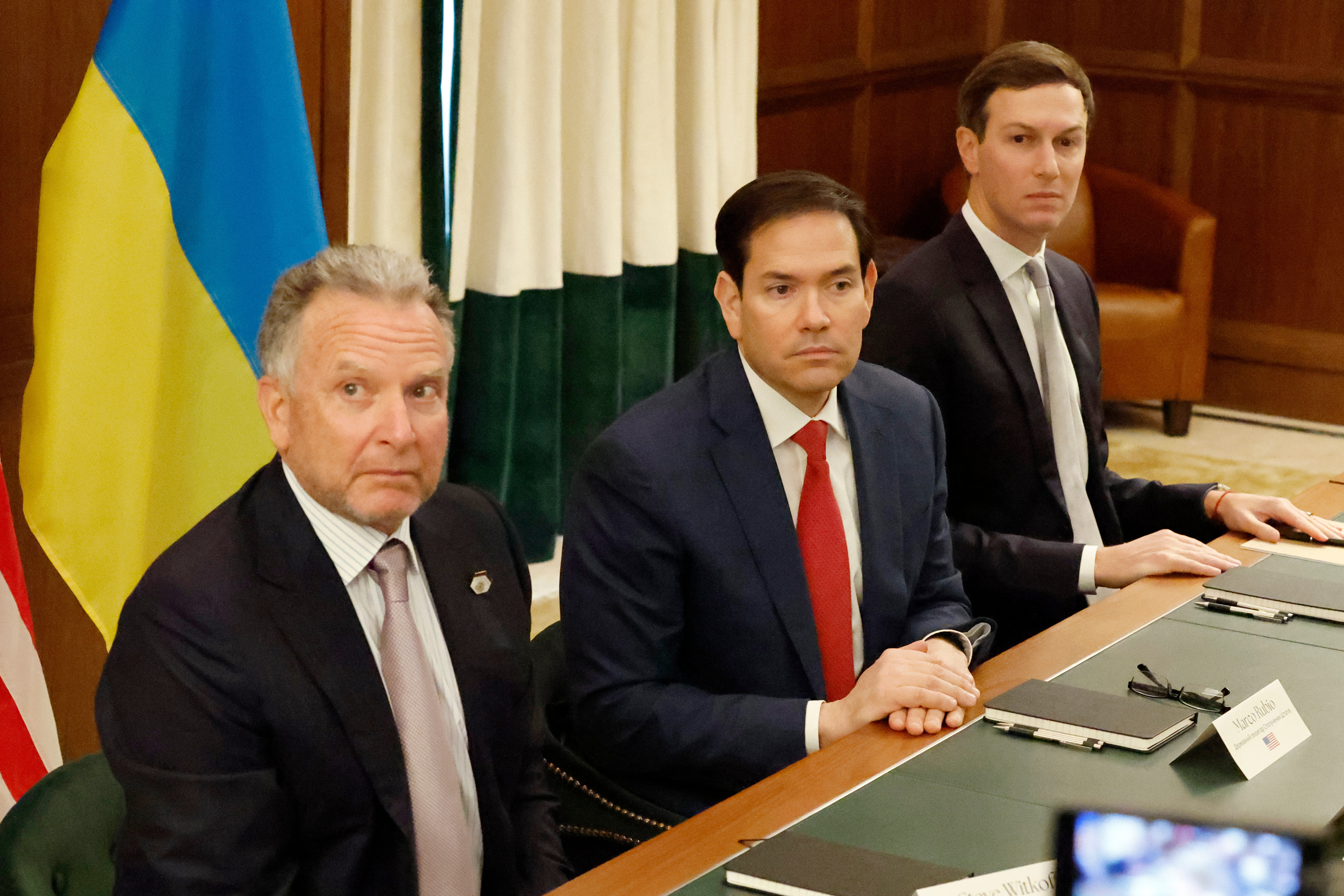 Steve Witkoff, Marco Rubio and Jared Kushner in front of Ukrainian flags