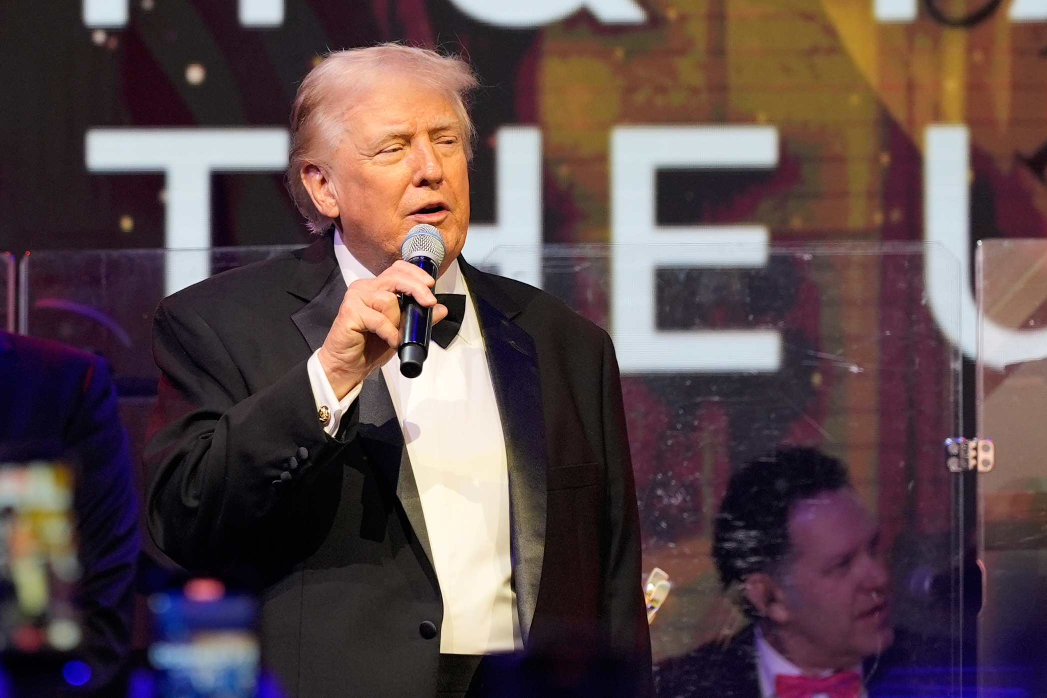 Donald Trump speaks into a microphone on New Year's Eve