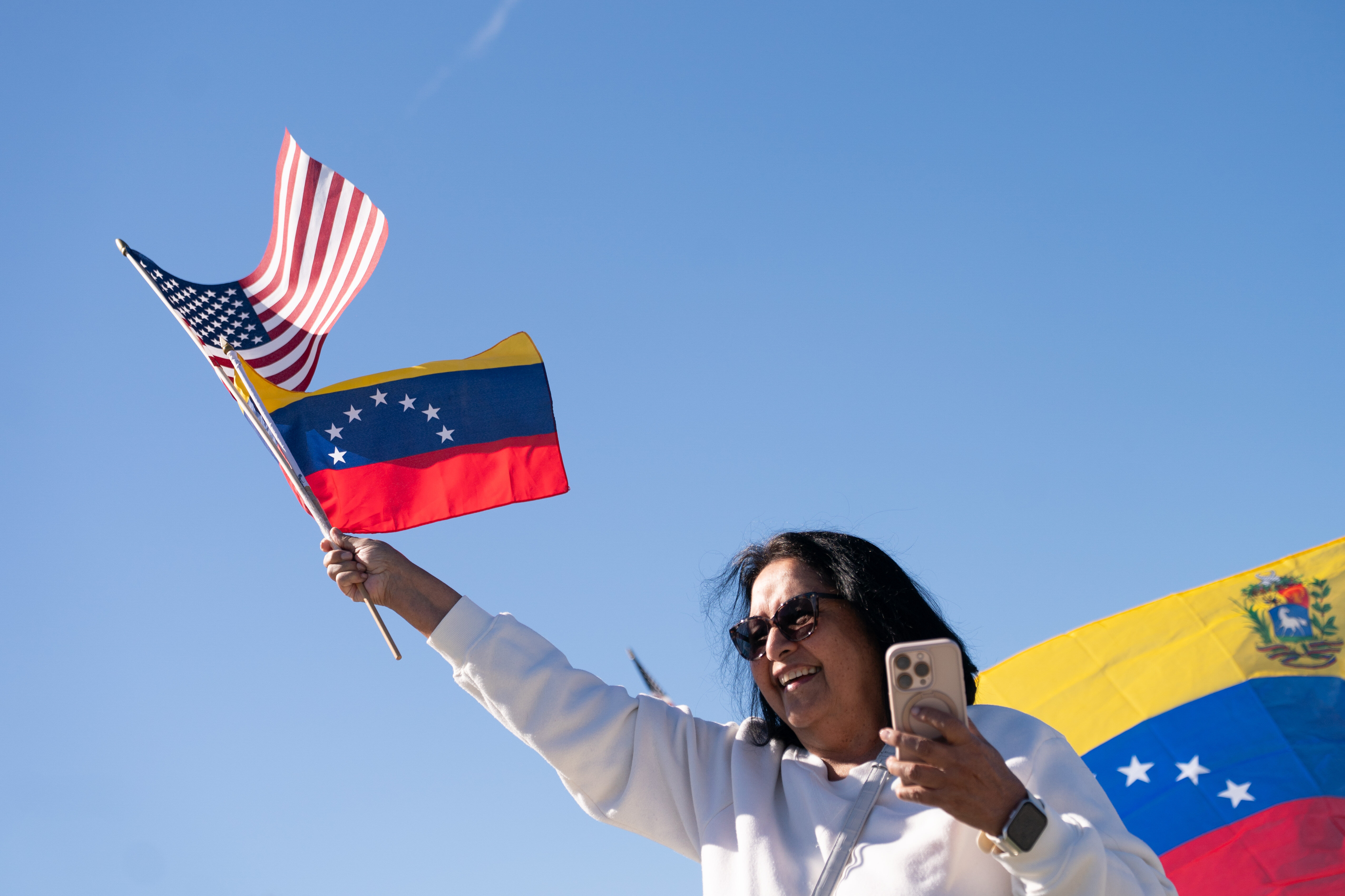 Venezuelans celebrate outside Mar-a-Lago.