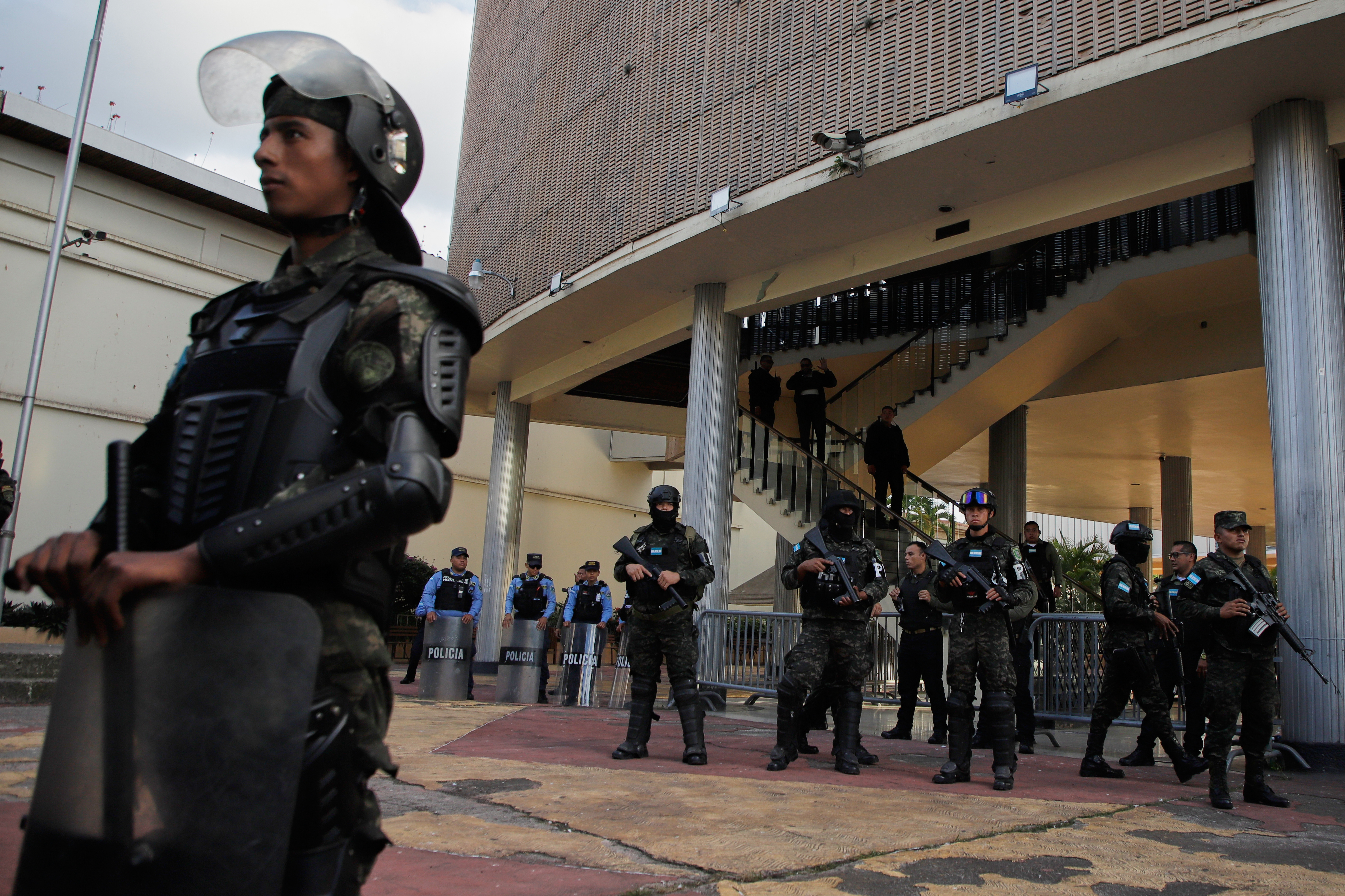 Military police stand outside of Honduras's Congress building.