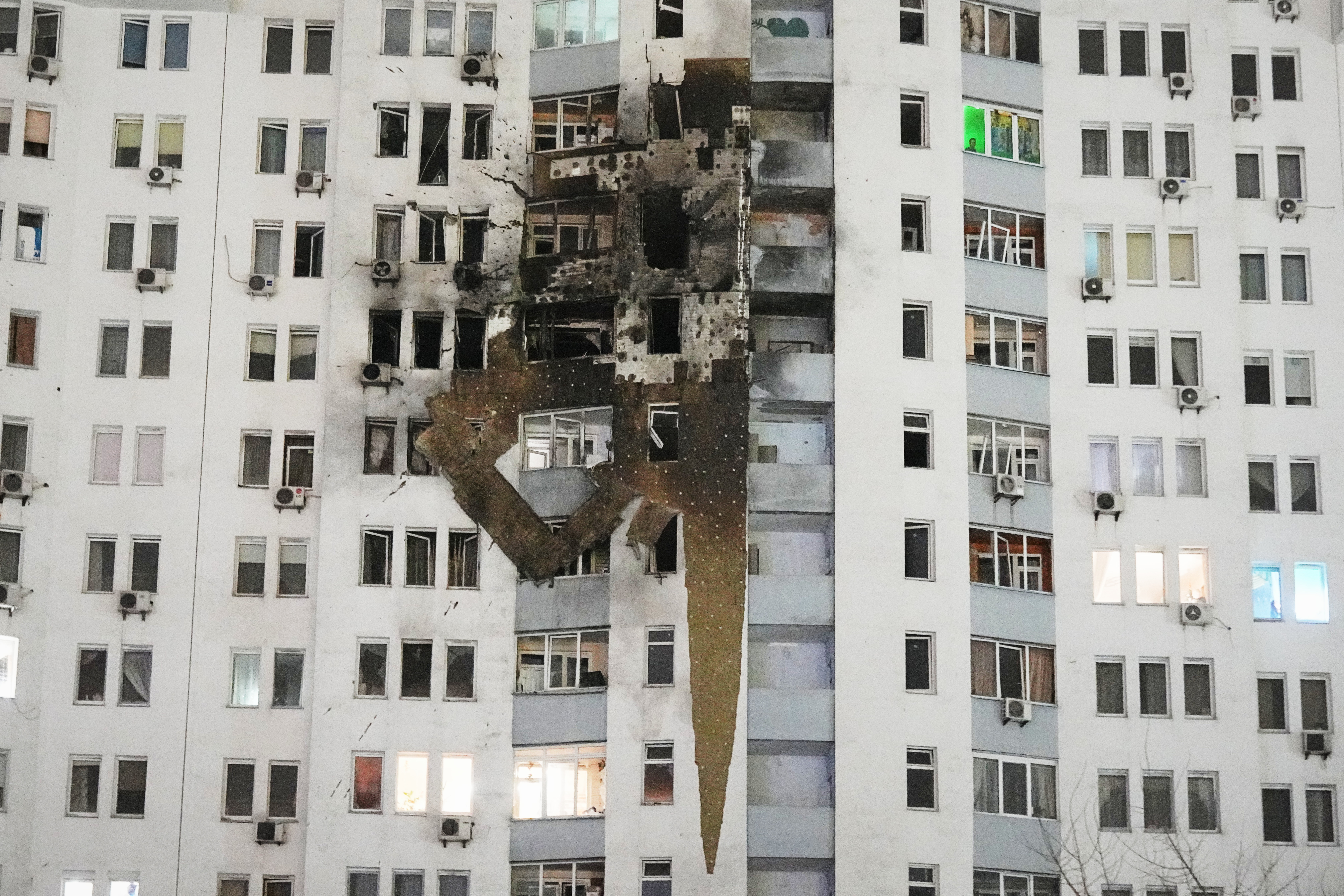 A residential building is seen damaged after a Russian strike in Kyiv, Ukraine, Friday, Jan. 9, 2026. (AP Photo/Efrem Lukatsky)