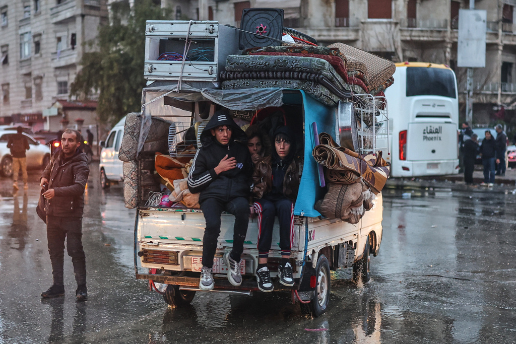 Residents flee the Sheikh Maqsoud neighborhood of Aleppo, Syria