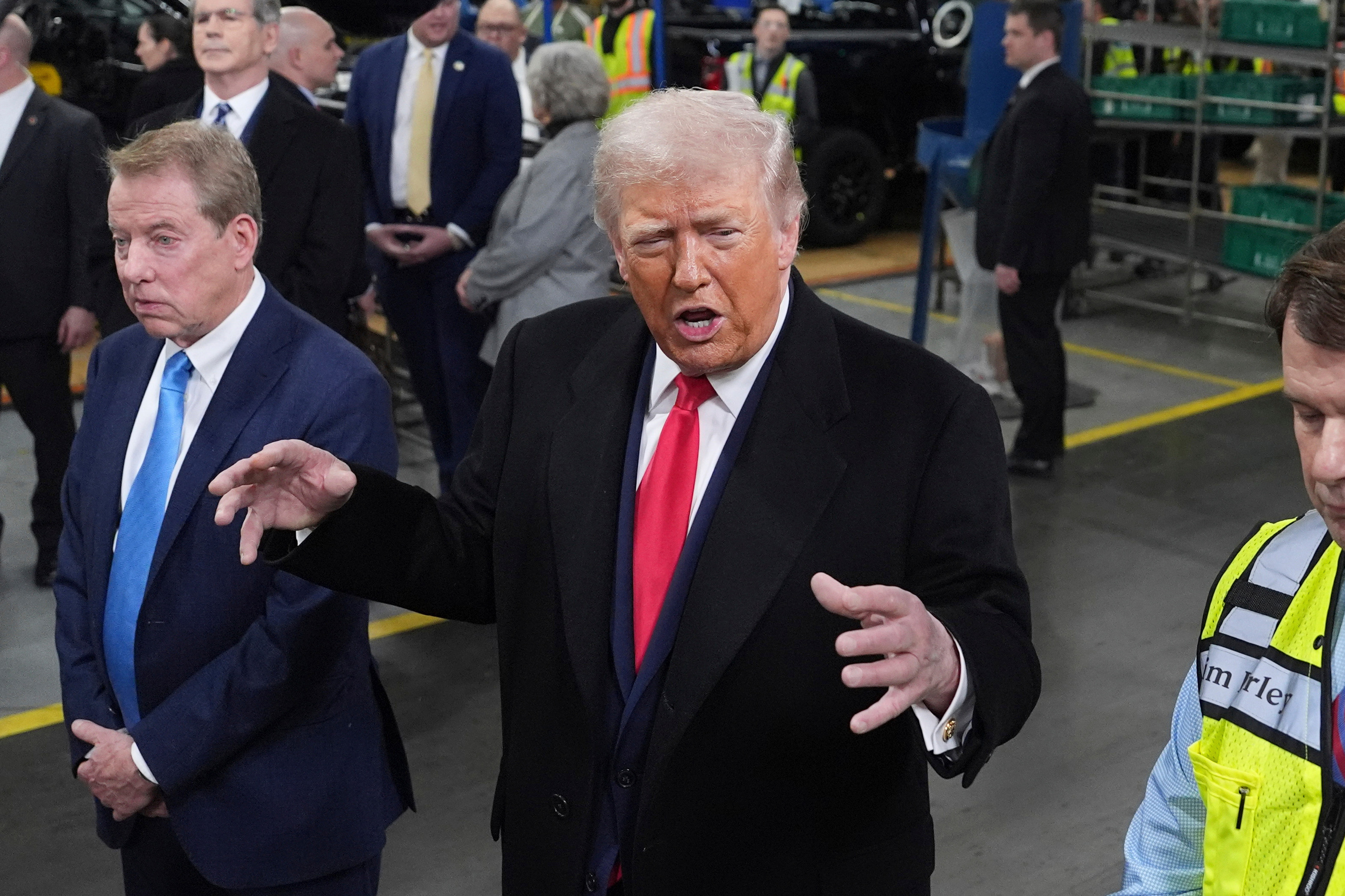 President Donald Trump speaks as Bill Ford, Executive Chairman of Ford, left, and Jim Farley, CEO of Ford, listen during a tour of the Ford River Rogue complex, Tuesday, Jan. 13, 2026, in Dearborn, Mich. [Evan Vucci/AP Photo]