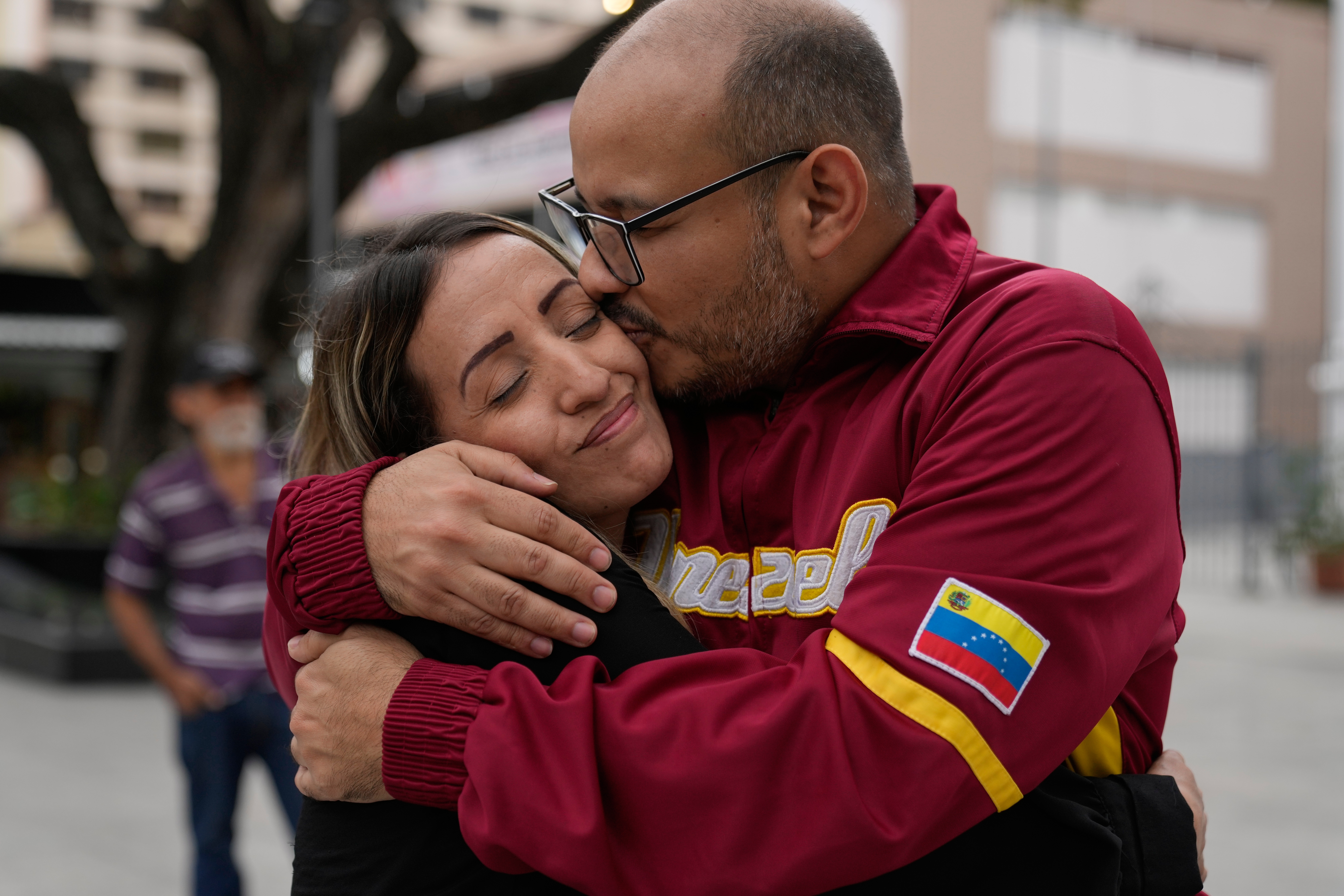 Two opposition members embrace in Venezuela