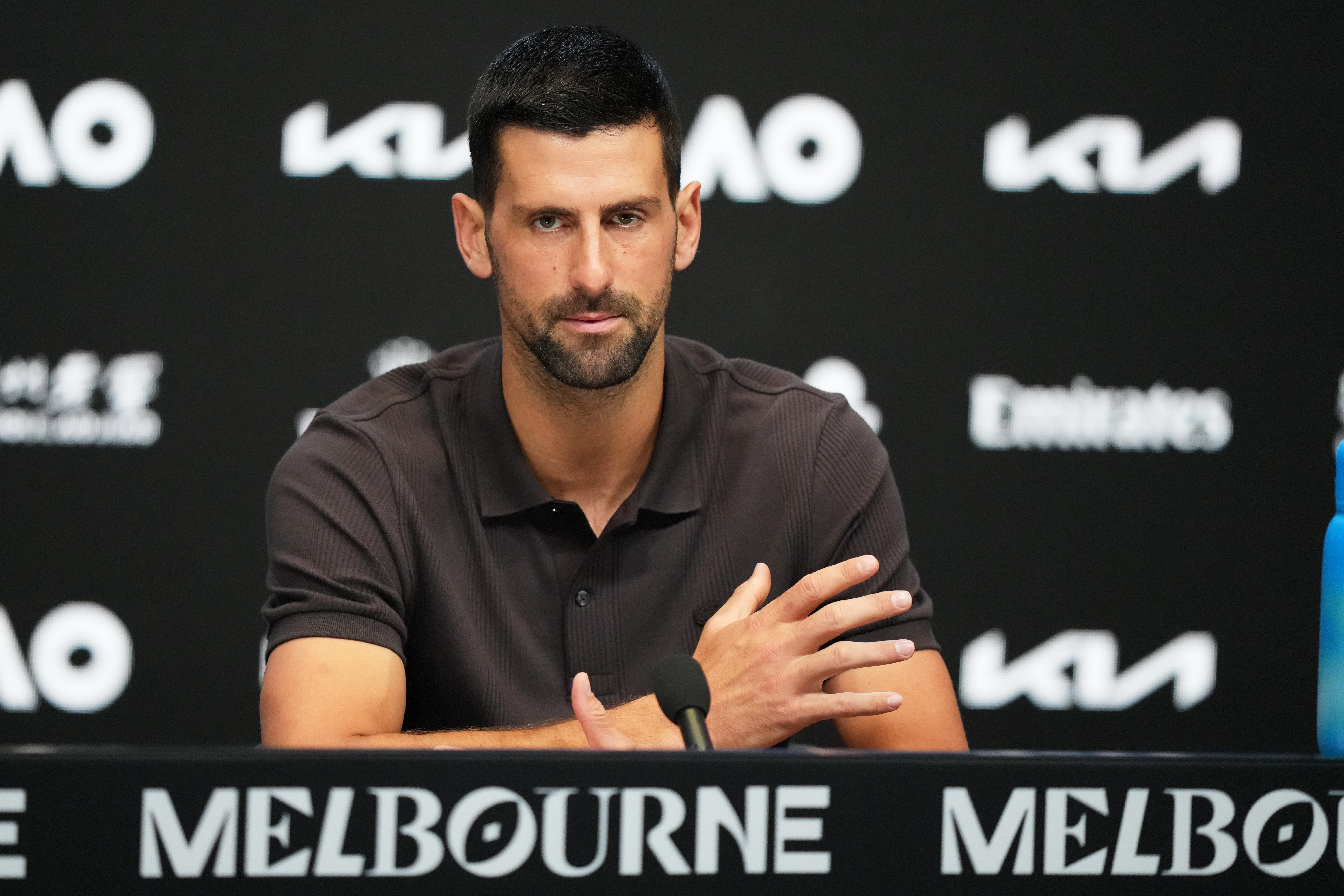Novak Djokovic of Serbia reacts during a news conference.