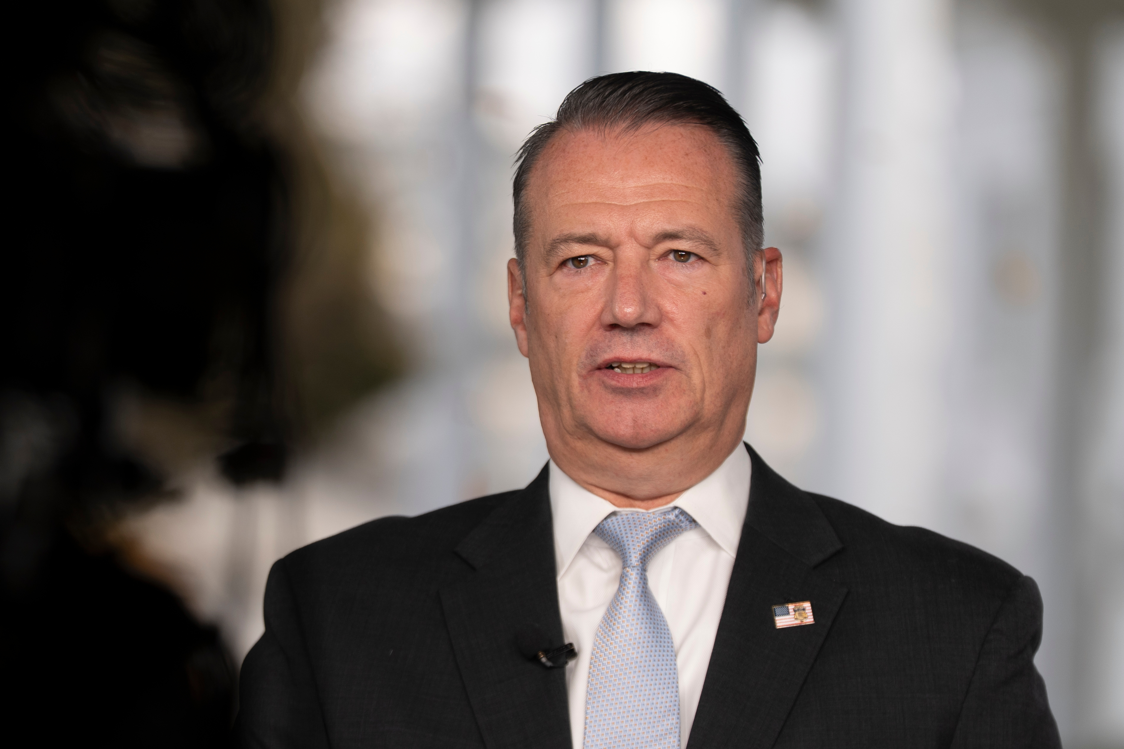 Todd Lyons, acting director of the US Immigration and Customs Enforcement (ICE) agency, is interviewed on TV on the White House grounds on November 3, 2025 in Washington.
