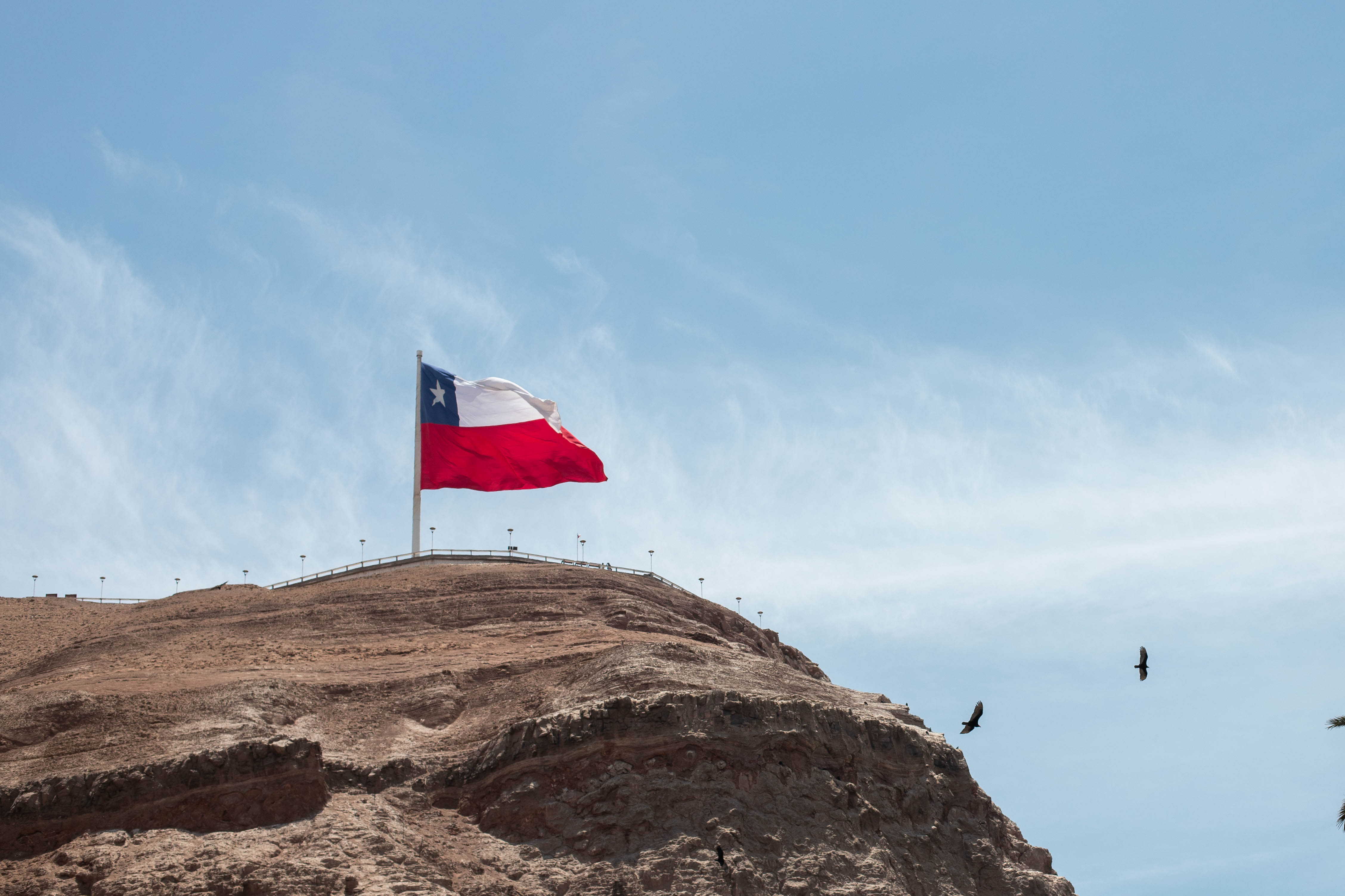 A Chilean flag is seen in the highlands at the country's northern border