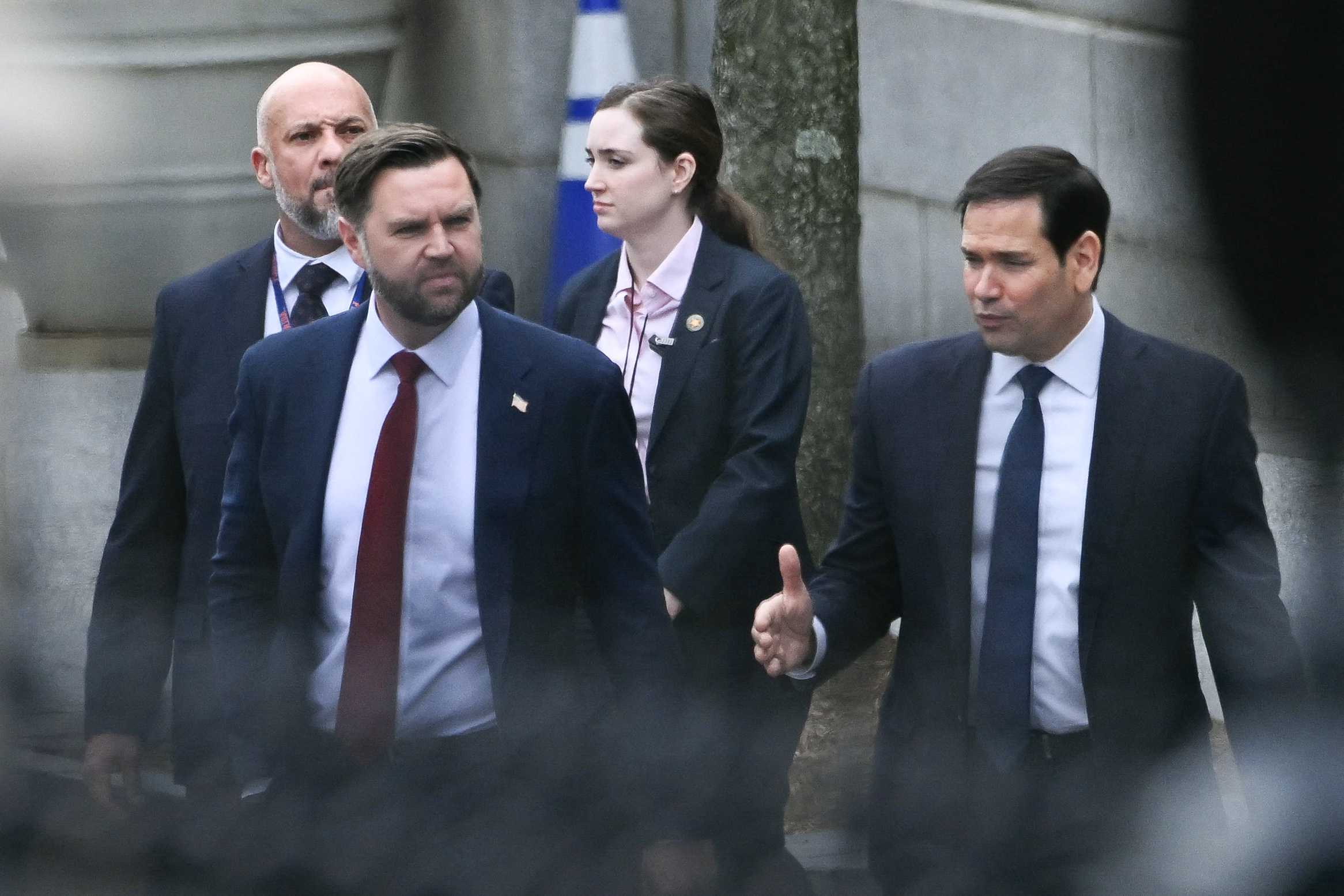(L/R) US Vice President JD Vance and Secretary of State Marco Rubio depart the Eisenhower Executive Office Building on the White House campus after a meeting with Danish Foreign Minister Lars Løkke Rasmussen and Greenland's Foreign Minister Vivian Motzfeldt in Washington, DC, on January 14, 2026.