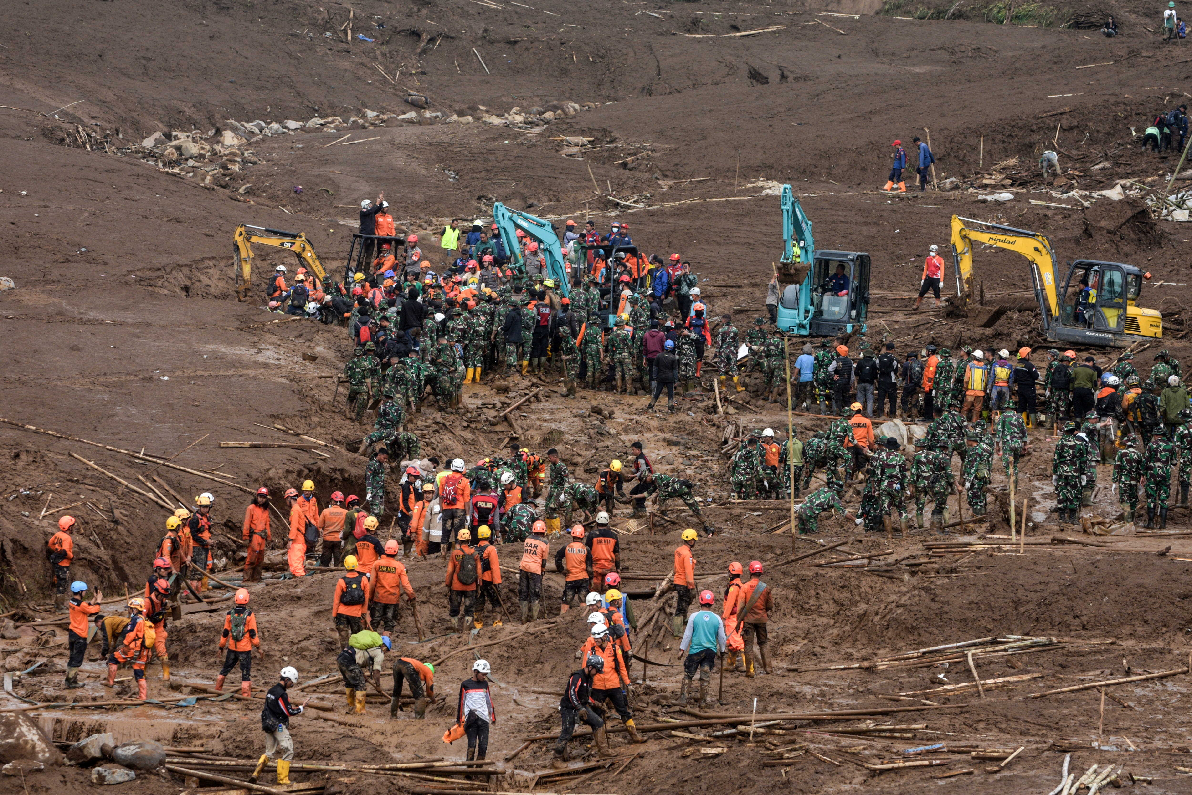 Rescuers search for victims buried by a landslide in Pasirlangu village in Cisarua, Bandung, West Java, on January 26, 2026.