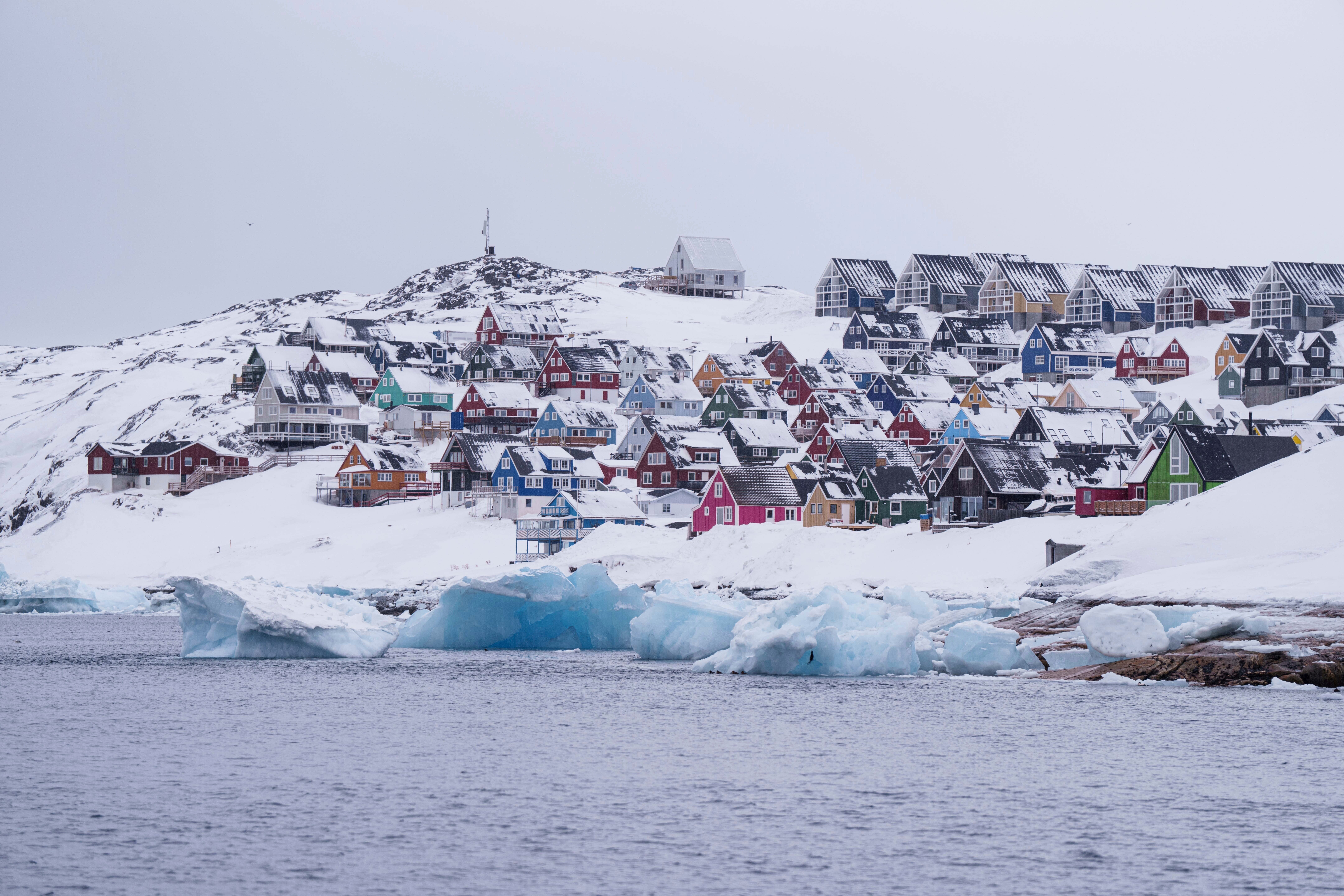 FILE - Coloured houses covered by snow are seen from the sea in Nuuk, Greenland, on March 6, 2025. (AP Photo/Evgeniy Maloletka, File)