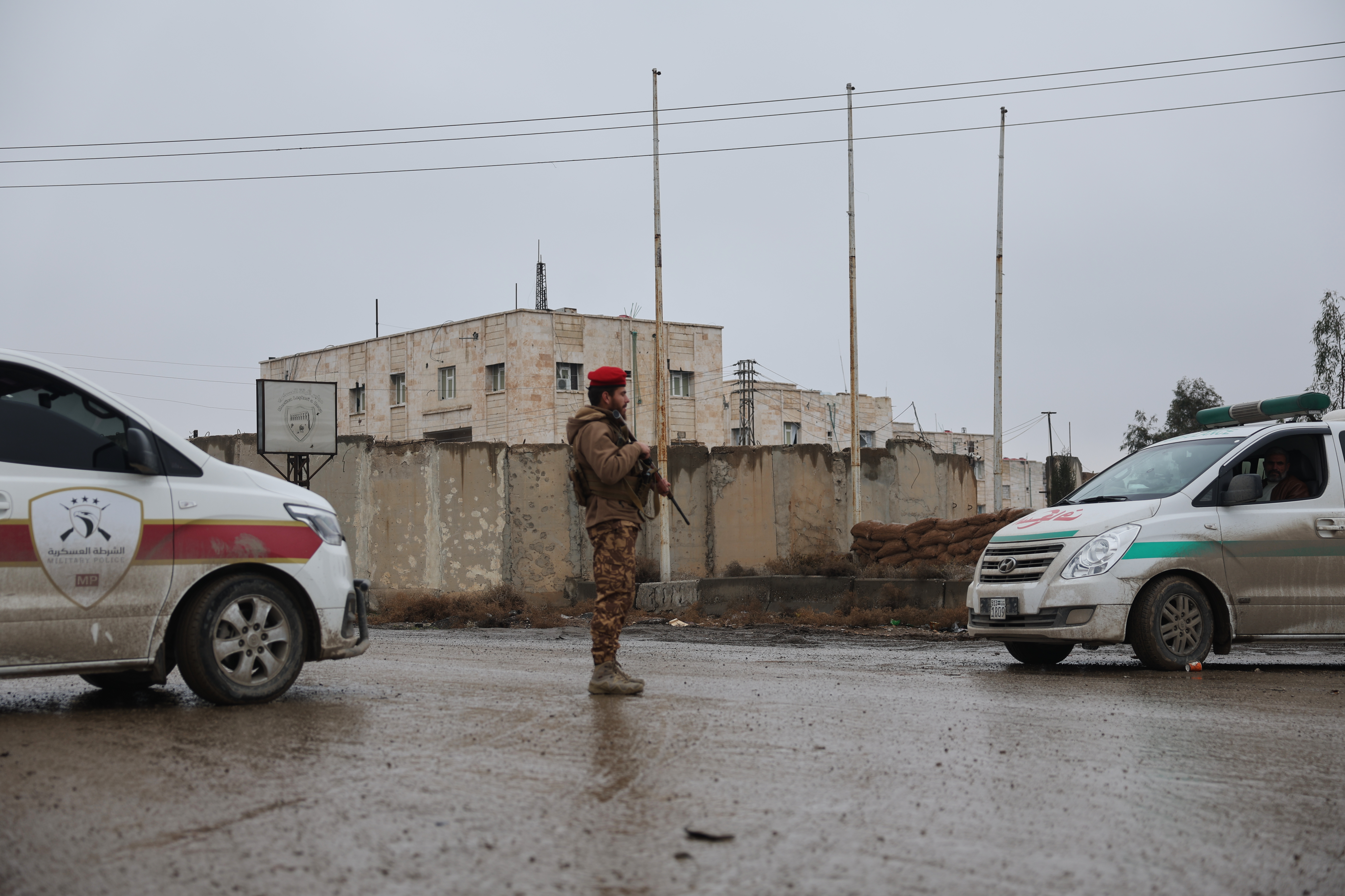 A Syrian government soldier stands guard at the al-Aqtan prison after taking control of it from the Kurdish-led Syrian Democratic Forces, SDF, in Raqqa, northeastern Syria, Friday, Jan. 23, 2026. (AP Photo/Ghaith Alsayed)