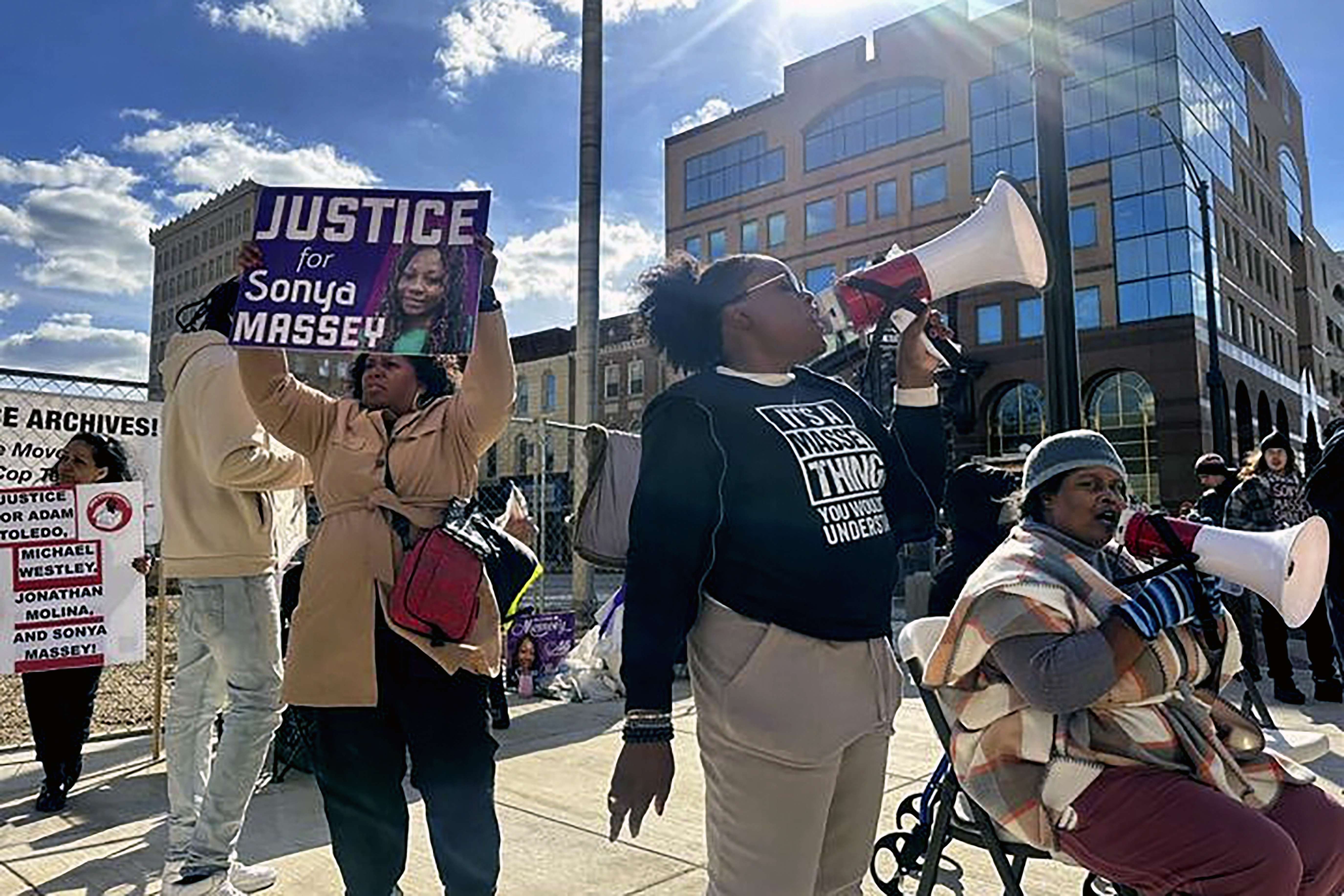 Supporters of Sonya Massey’s family gather outside the Peoria County Courthouse in Peoria, Ill., Wednesday, October 29, 2025. (AP Photo/John O’Connor)