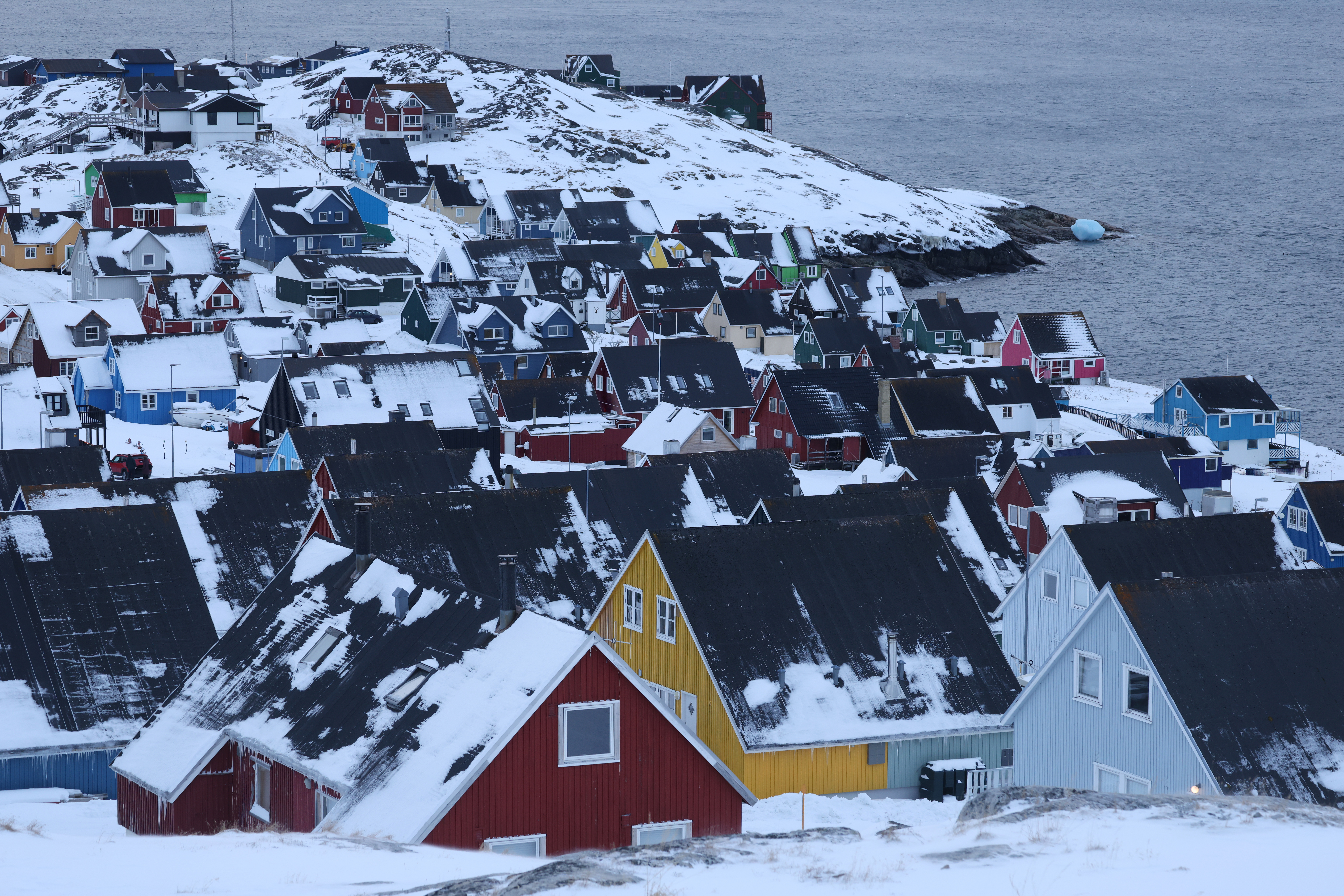 NUUK, GREENLAND - JANUARY 21: Residential houses stand next to fjord on January 21, 2026 in Nuuk, Greenland. European leaders are scheduled to meet later this week to formulate their response to U.S. President Donald Trump's recent threat of punitive tariffs against countries who obstruct his desire to acquire Greenland. (Photo by Sean Gallup/Getty Images)