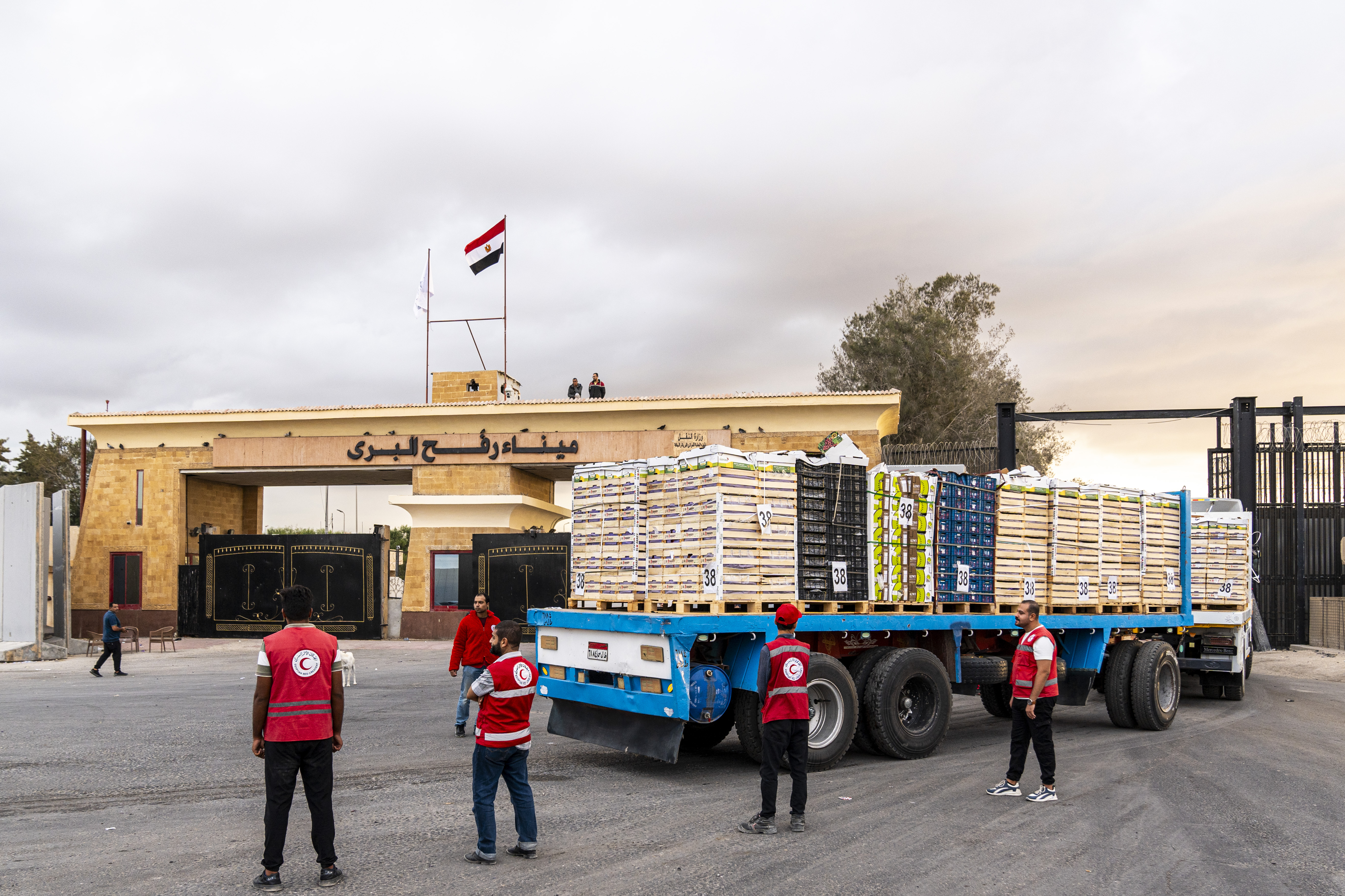 Truck carrying aid enter Gaza through the border crossing on in Rafah, Egypt.