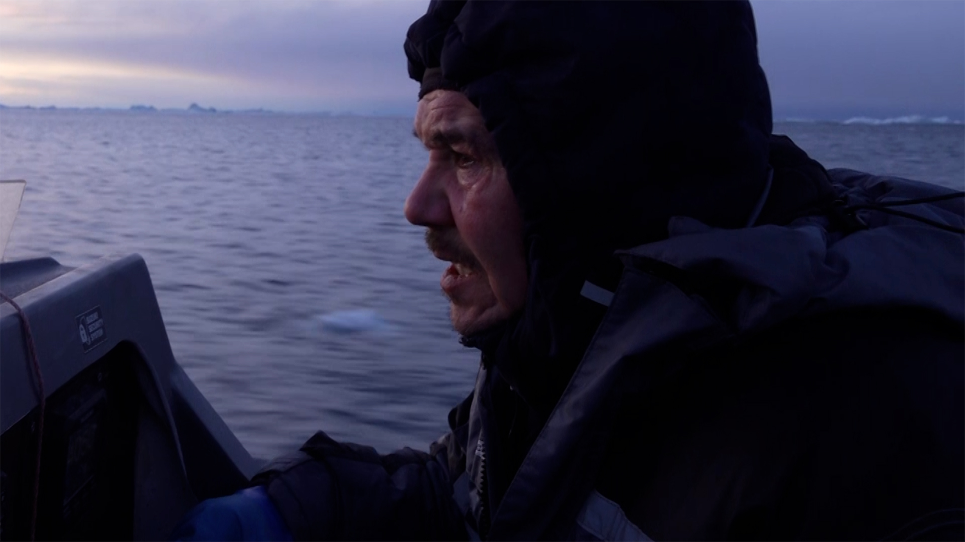 Greenlandic fishermen Joel Hansen pilots his fishing boat in Ilulissat, Greenland. [Al Jazeera]