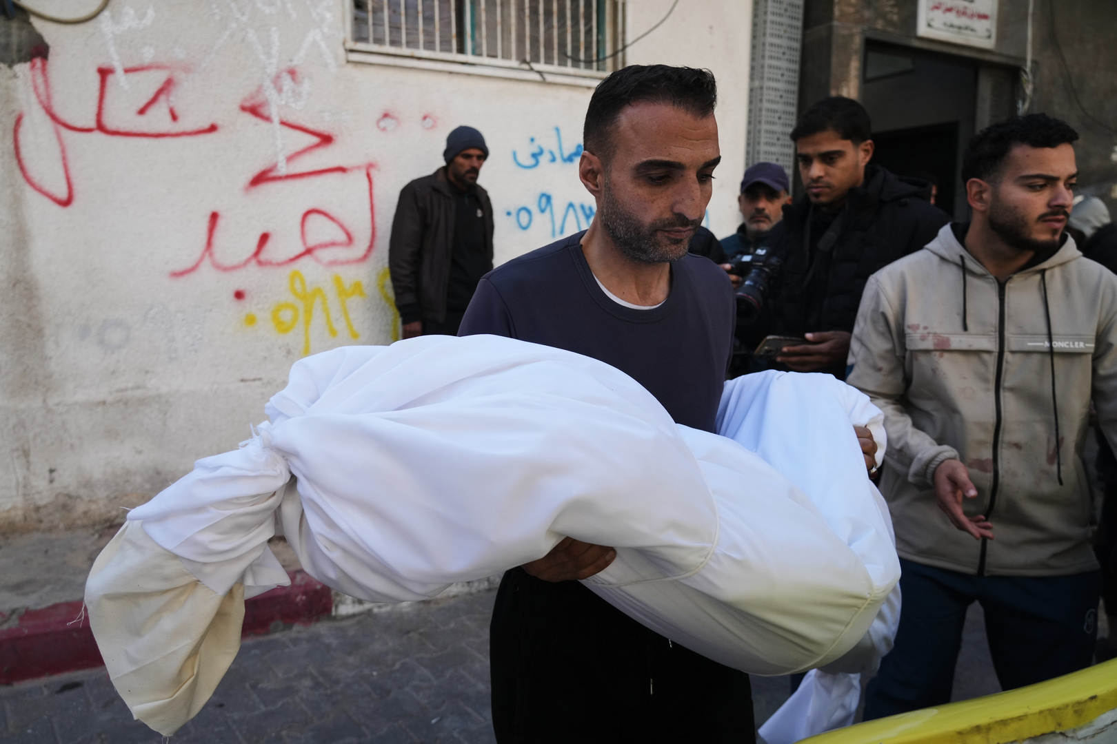 The body of 11-year-old Palestinian girl Hamsa Hosou, killed by Israeli fire in Jabalia, is brought to Shifa Hospital in Gaza City on Jan. 8, 2026. [Jehad Alshrafi/AP]