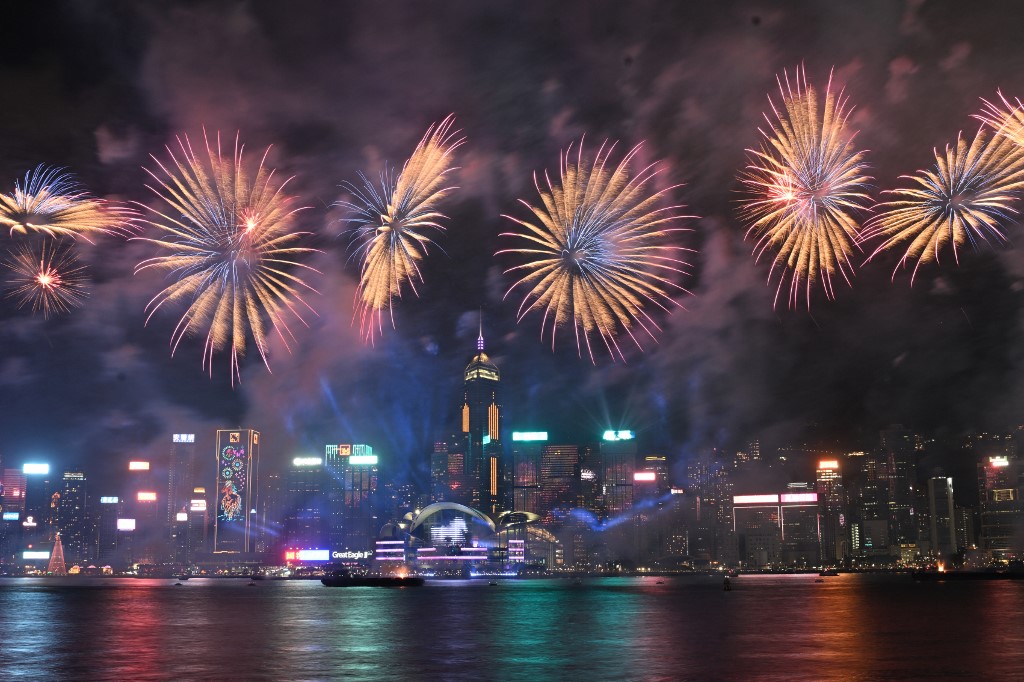 Fireworks light up the sky over Victoria Harbour on second day of the Lunar New Year of the Horse, in Hong Kong on February 18, 2026. (Photo by Peter PARKS / AFP)