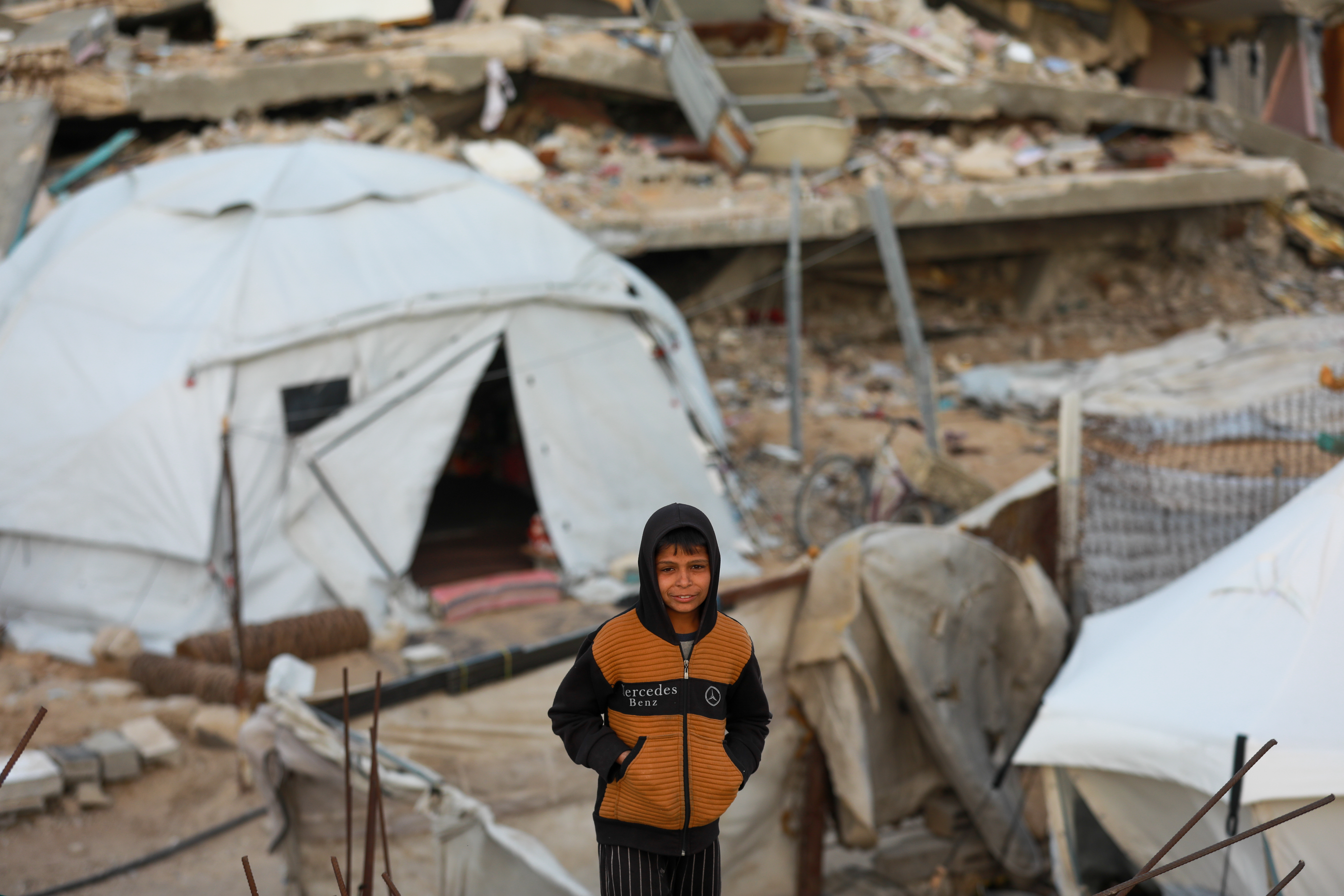 A child stands in one of the makeshift displacement camps.